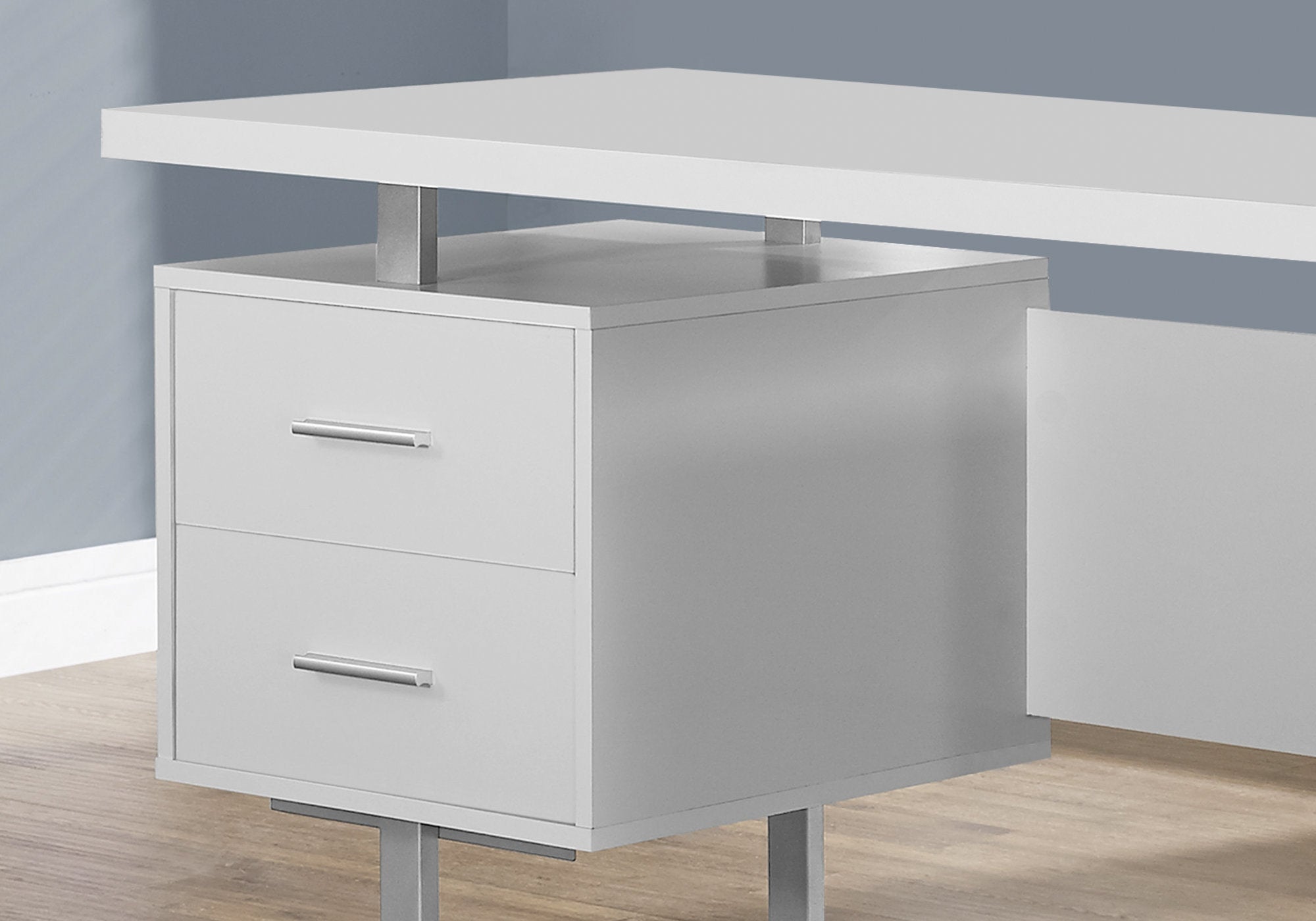 A modern white and silver particle board desk with two drawers and a cubby space, showcasing a glossy finish and sleek design.