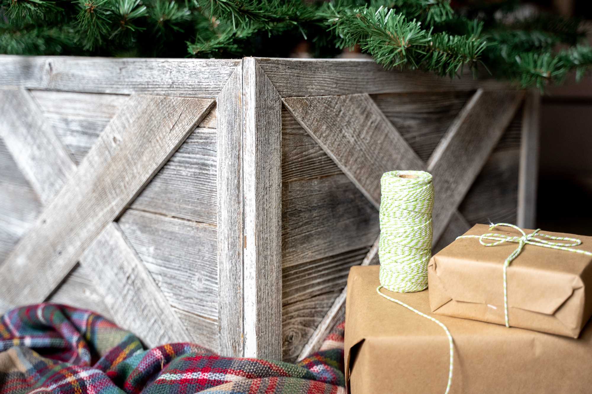 23-inch Natural Weathered Gray Whitewash Christmas Tree Collar featuring rustic X design, made from reclaimed wood, enhancing holiday decor.