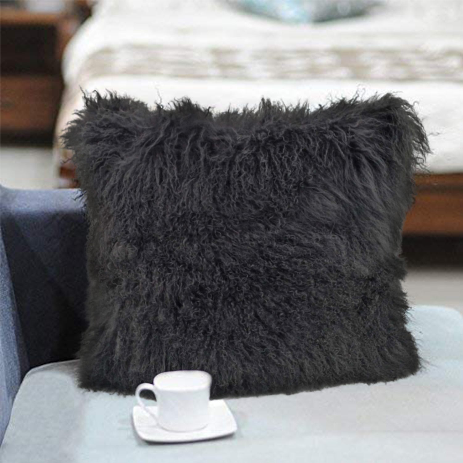 24-inch charcoal genuine Tibetan lamb fur pillow with soft microsuede backing, showcasing luxurious texture and elegant design.