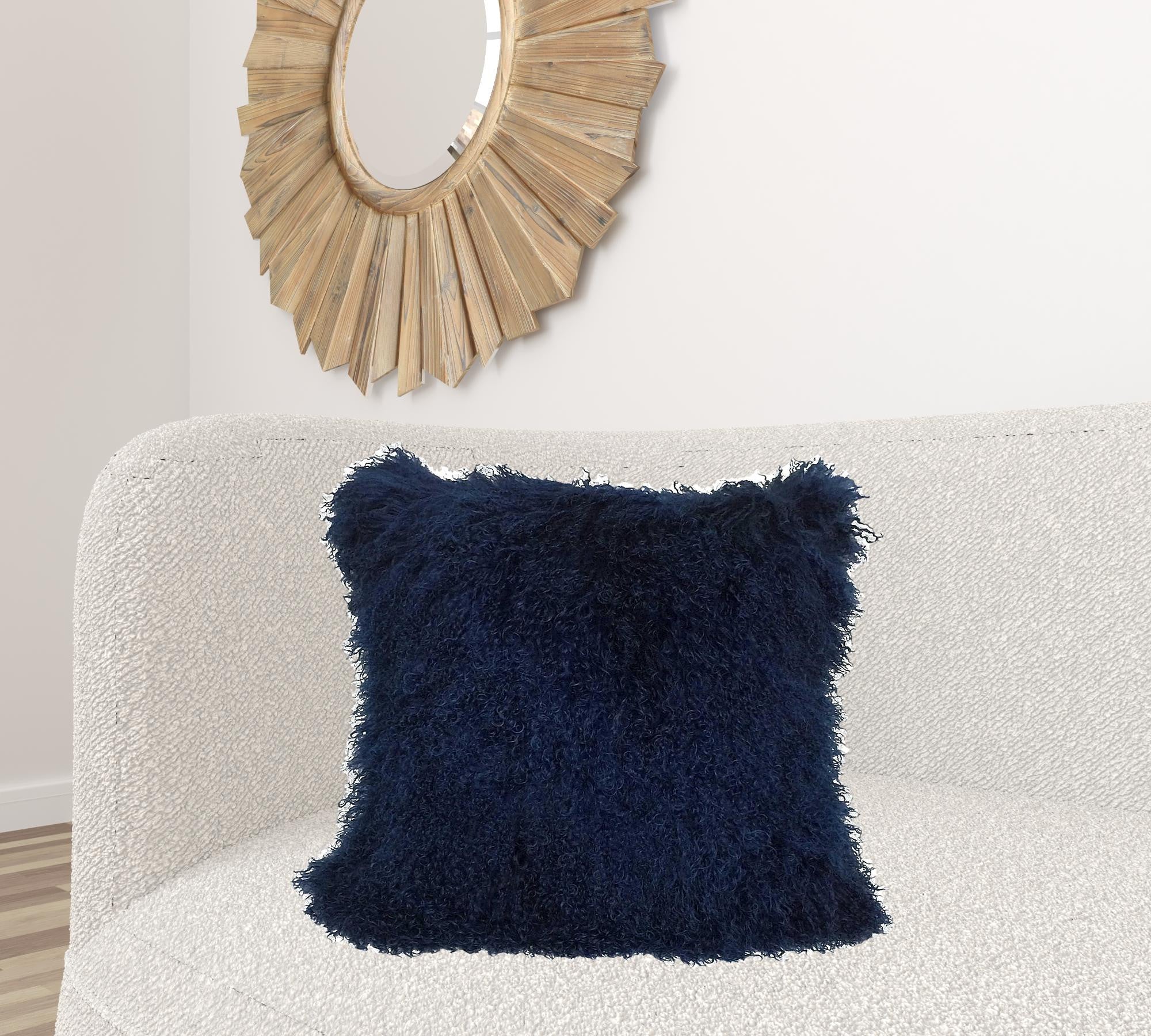 24-inch navy blue genuine Tibetan lamb fur pillow with soft microsuede backing, showcasing its luxurious texture and elegant design.