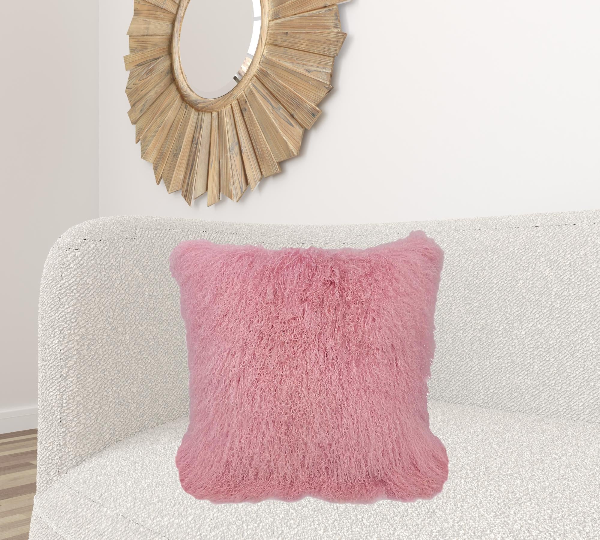 24-inch pink genuine Tibetan lamb fur pillow with soft microsuede backing, showcasing its luxurious texture and elegant design.