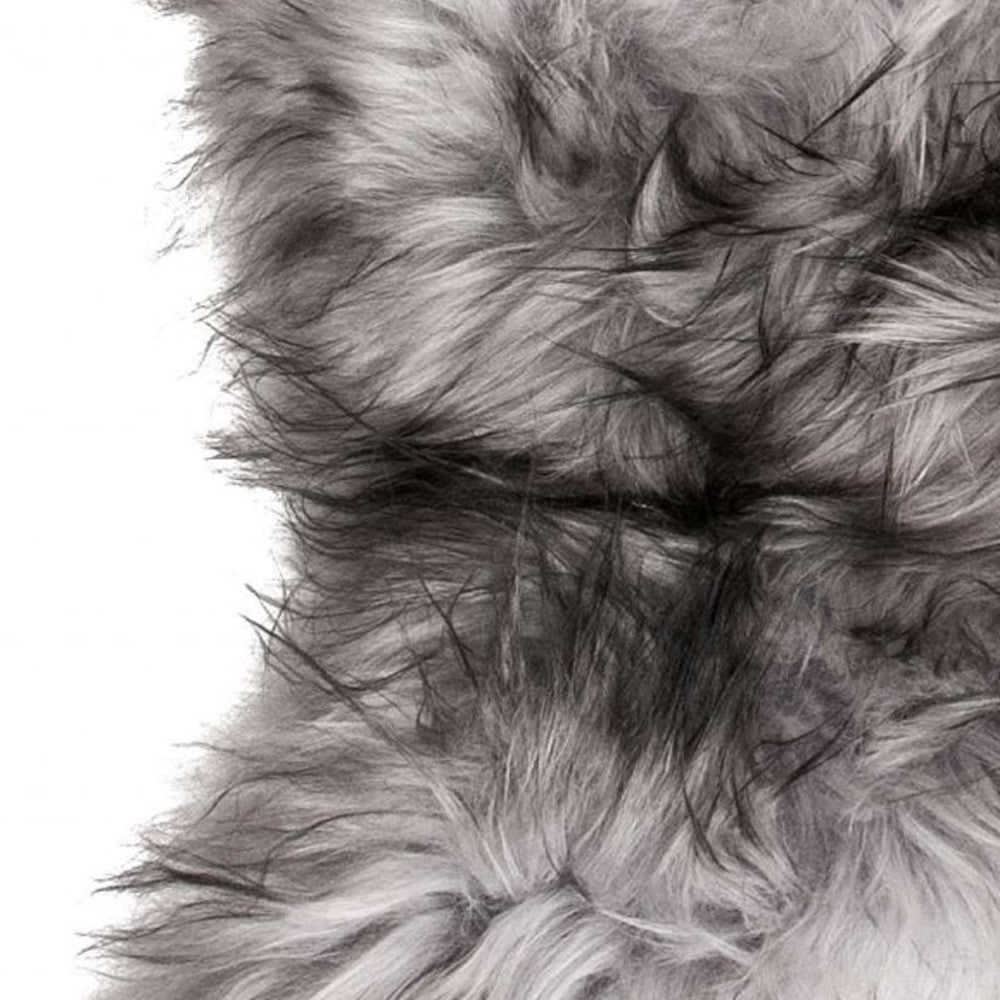 Luxurious 24x36 inches metallic silver sheepskin area rug with long hair, perfect for enhancing home decor.