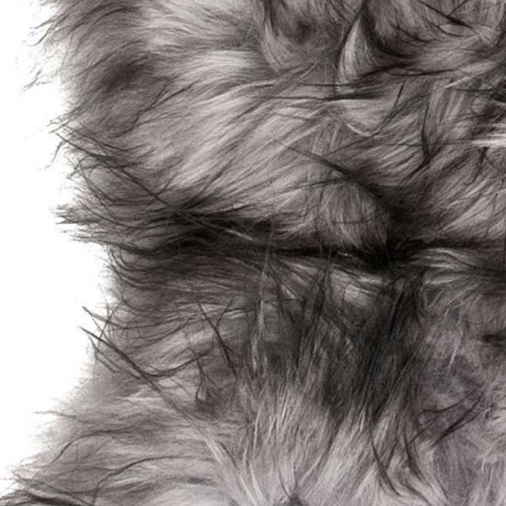 Luxurious 24x36 inches metallic silver sheepskin area rug with long hair, perfect for enhancing home decor.