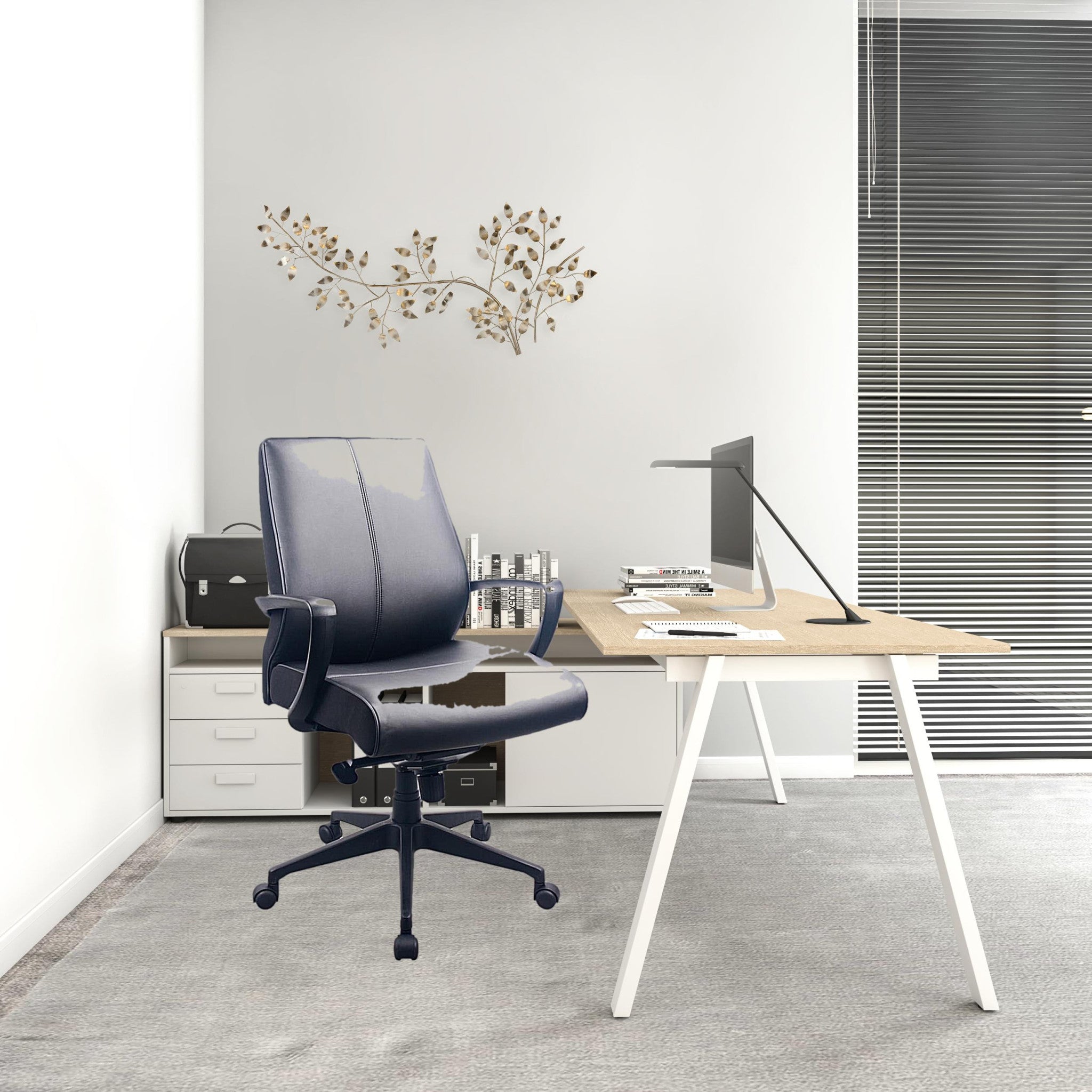 A stylish black leather office chair with adjustable features, padded seat, and metal base with caster wheels, perfect for any workspace.