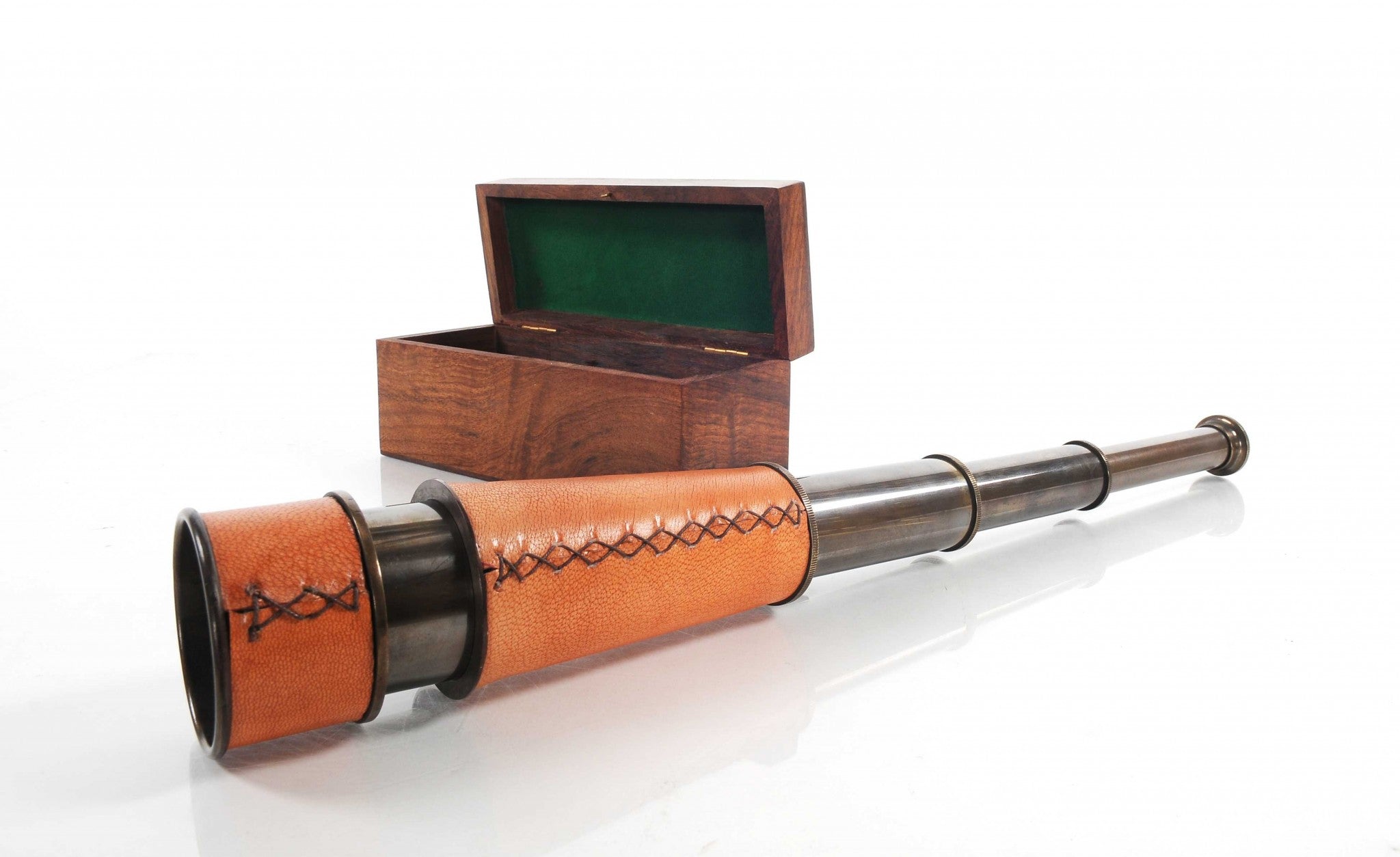 A beautifully crafted handheld telescope made of brass, featuring an antique leather overlay, displayed in an elegant rosewood gift box.