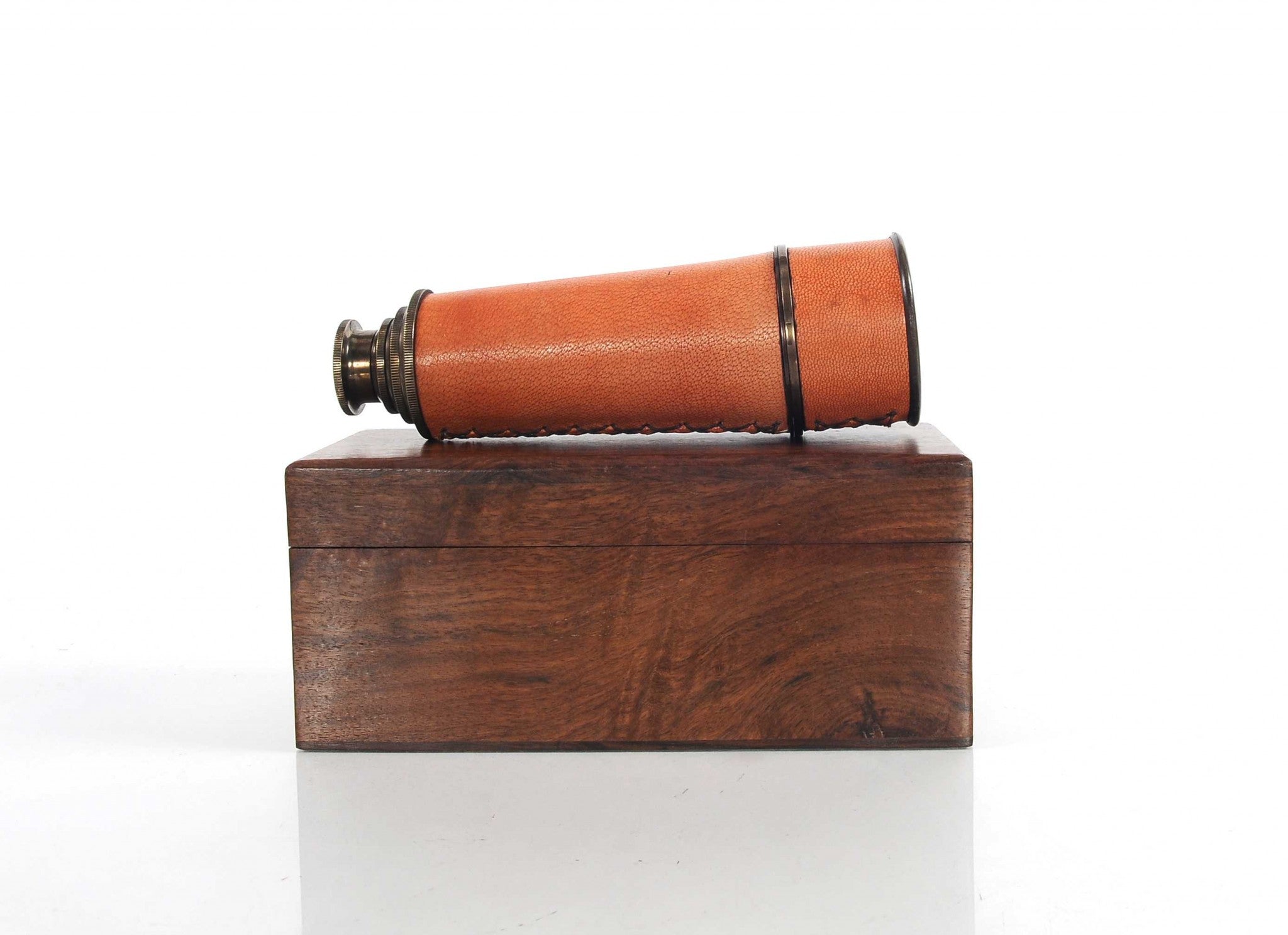 A beautifully crafted handheld telescope made of brass, featuring an antique leather overlay, displayed in an elegant rosewood gift box.