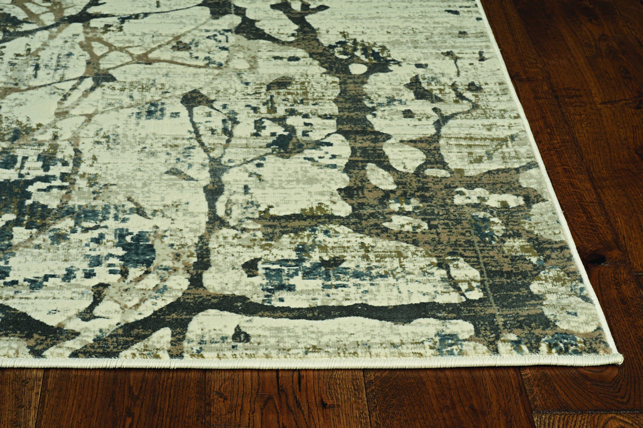 A beautiful 26" X 83" Ivory or Mist Polypropylene or Viscose Rug featuring modern vintage distressed patterns and soft sheen highlights.