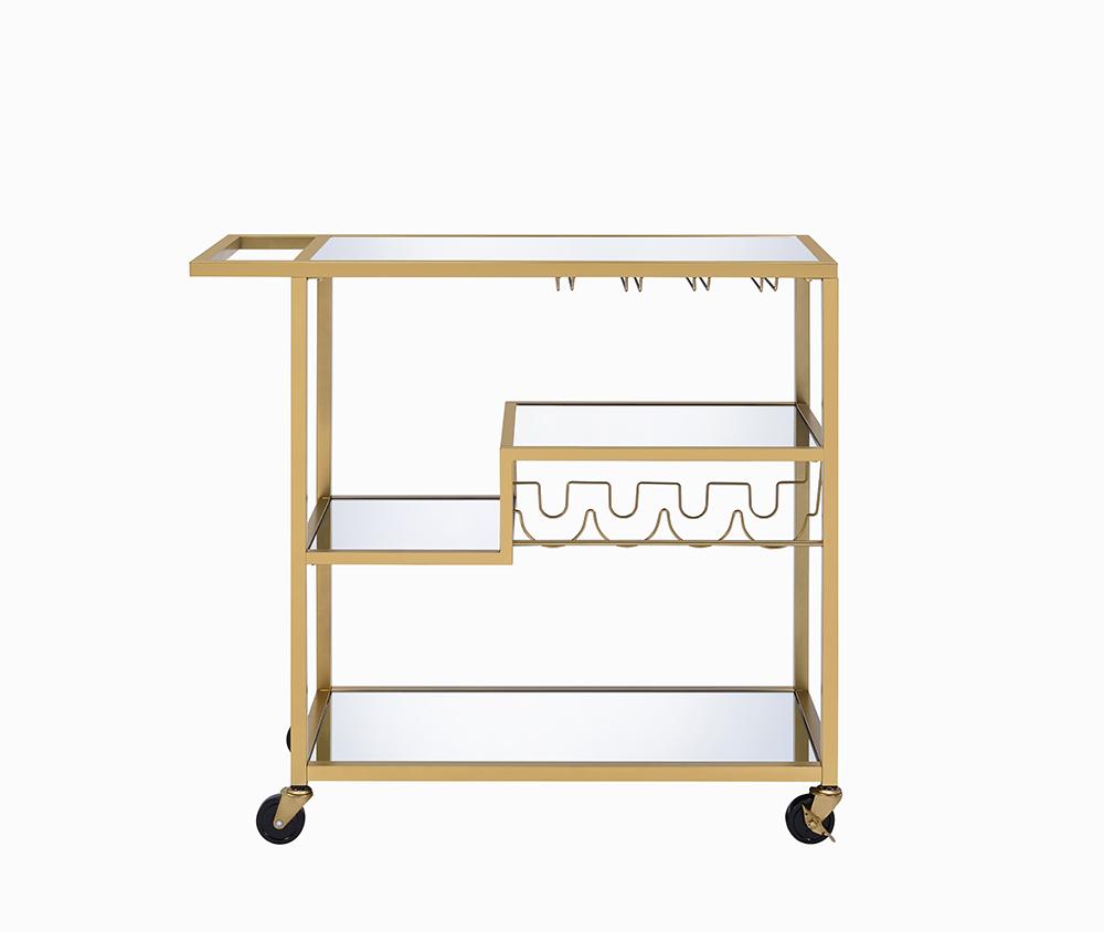 Elegant gold and clear glass serving cart with three shelves and caster wheels, perfect for serving meals and drinks.