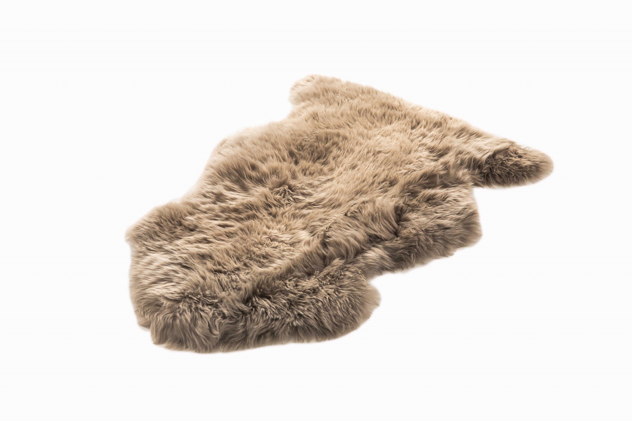 A luxurious 2x3 inches Latte New Zealand Natural Sheepskin Rug showcasing its rich latte taupe color and plush texture, perfect for home decor.