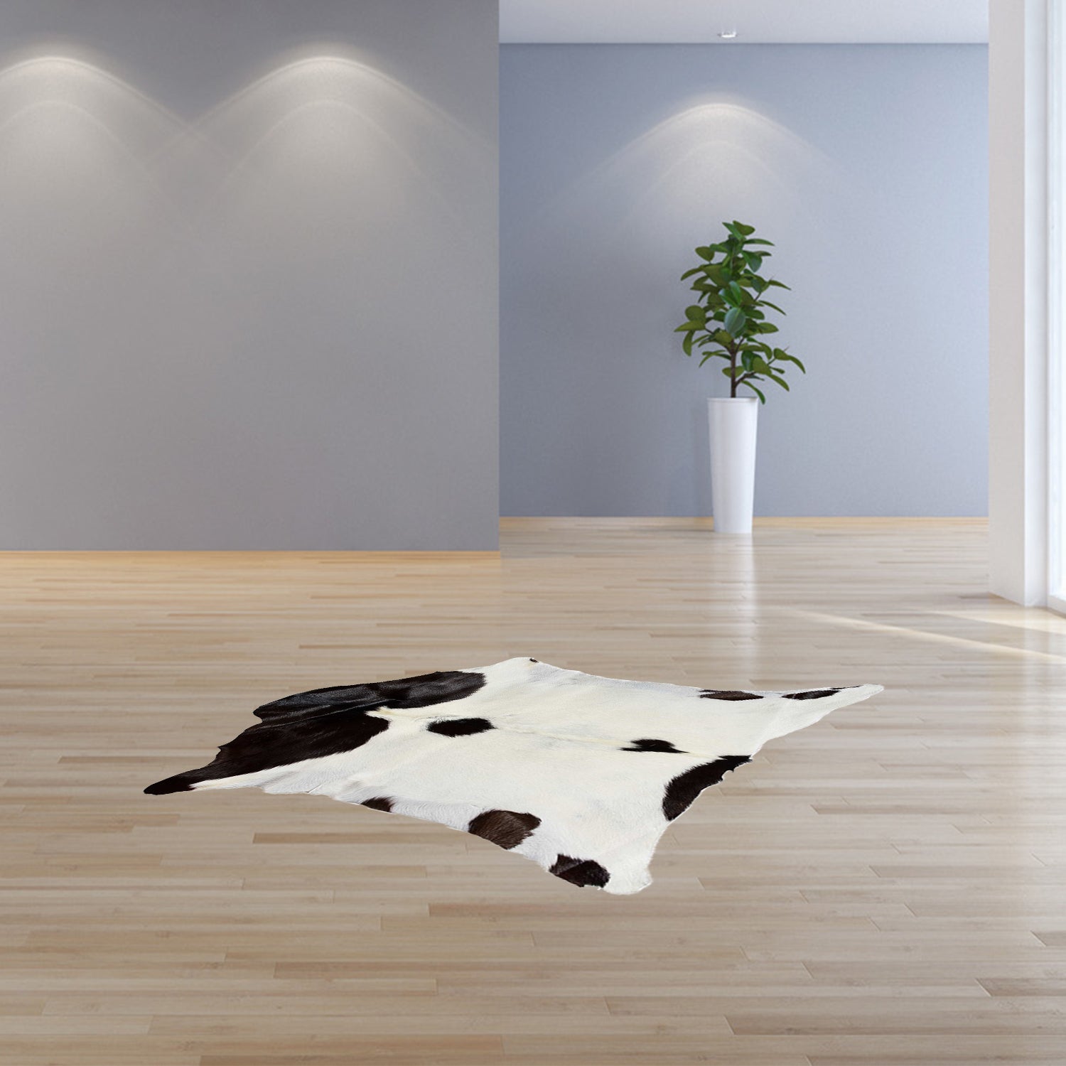 A luxurious 2x3 natural black and white calfskin area rug showcasing rich chocolate and white colors, perfect for enhancing any living space.