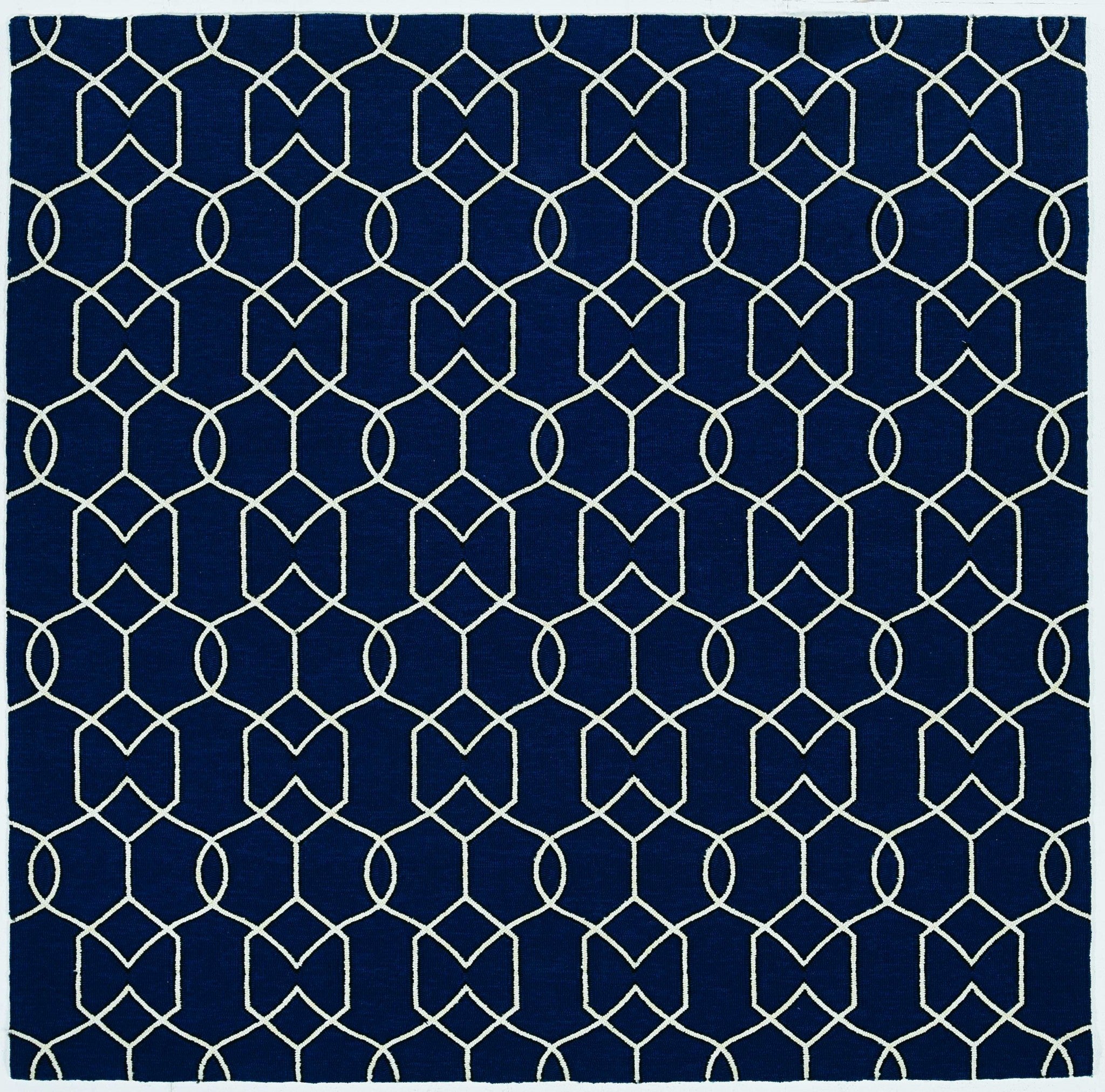 A stylish 2x3 navy accent rug made of UV treated polypropylene, showcasing a contemporary design suitable for indoor and outdoor use.