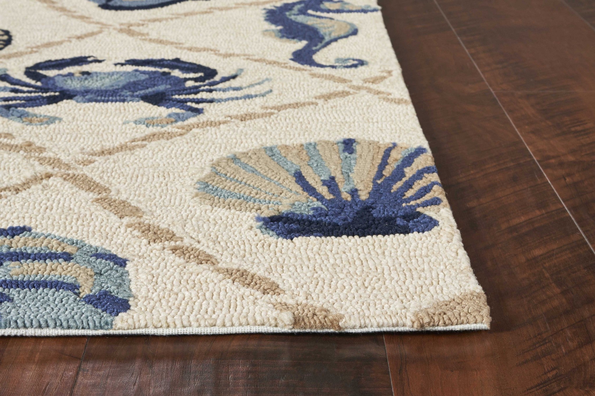 A stylish 2x3 inches UV treated polypropylene sand accent rug featuring modern paint-dripping effects and layered designs in a contemporary beige color.