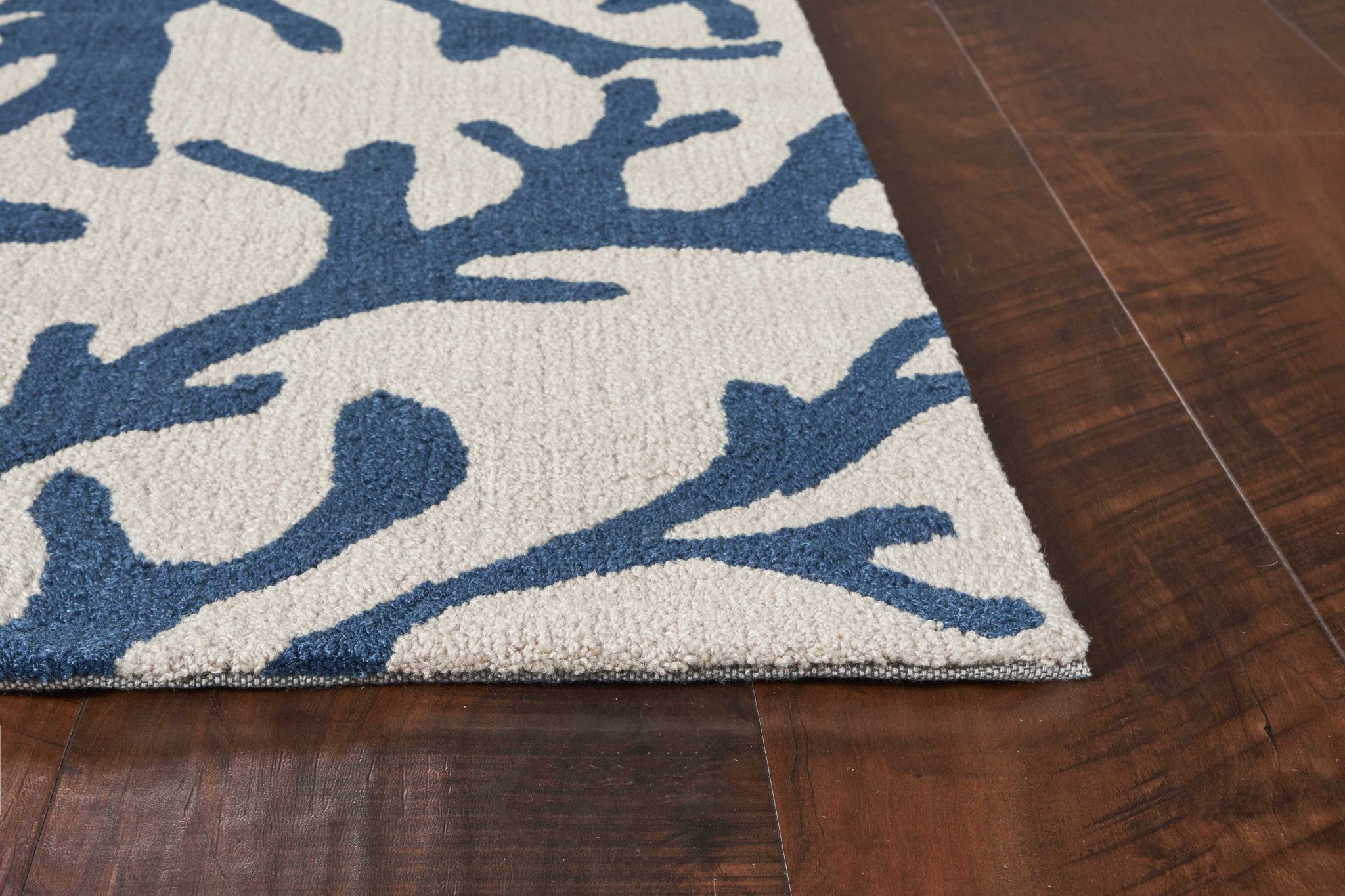 Ivory blue hand hooked oversized coral reef indoor rug, showcasing a beautiful coral reef design with a soft texture.