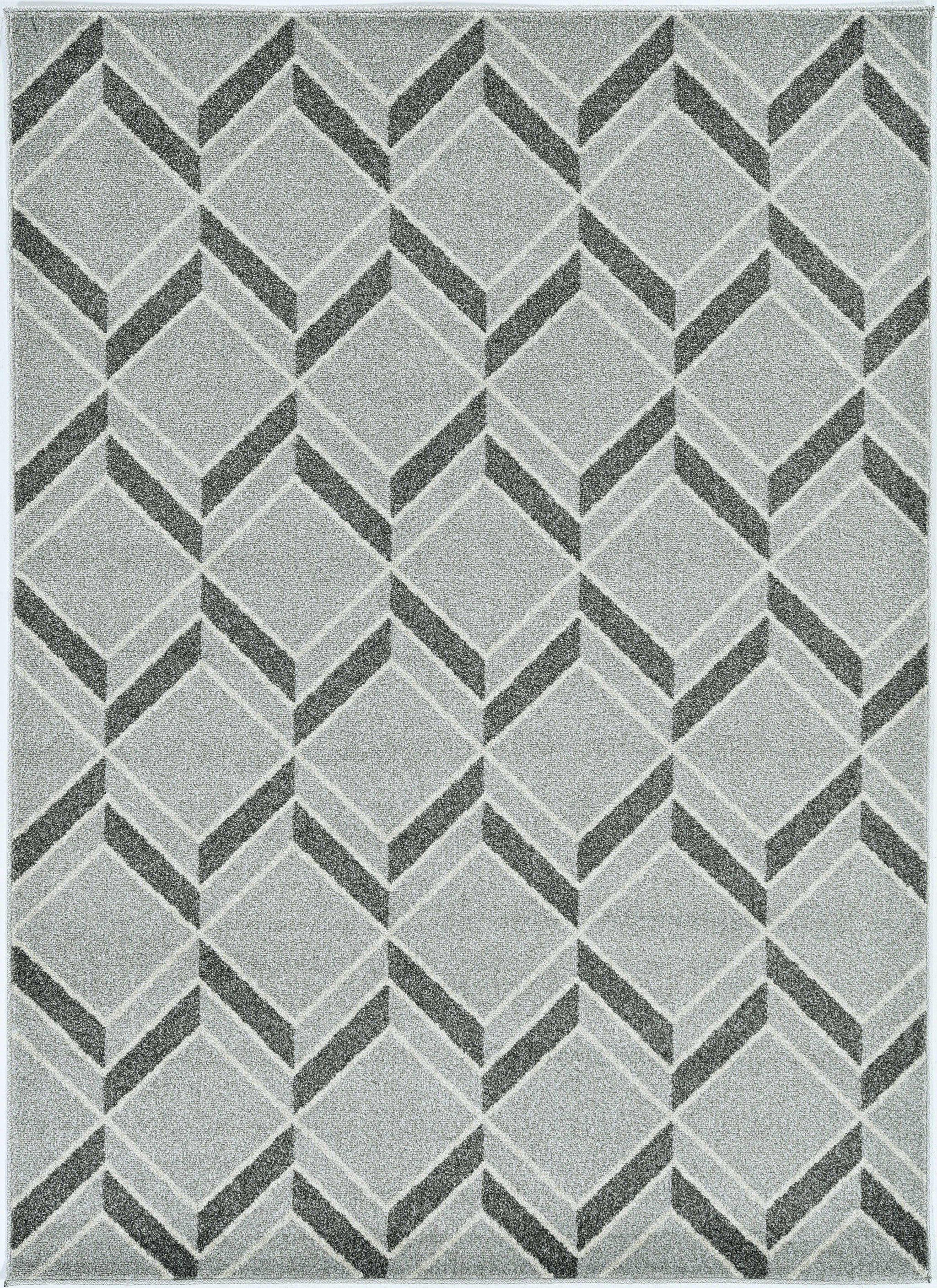 A stylish 2x4 grey herringbone illusion rug, machine woven and UV treated for outdoor durability, displayed on a wooden deck.