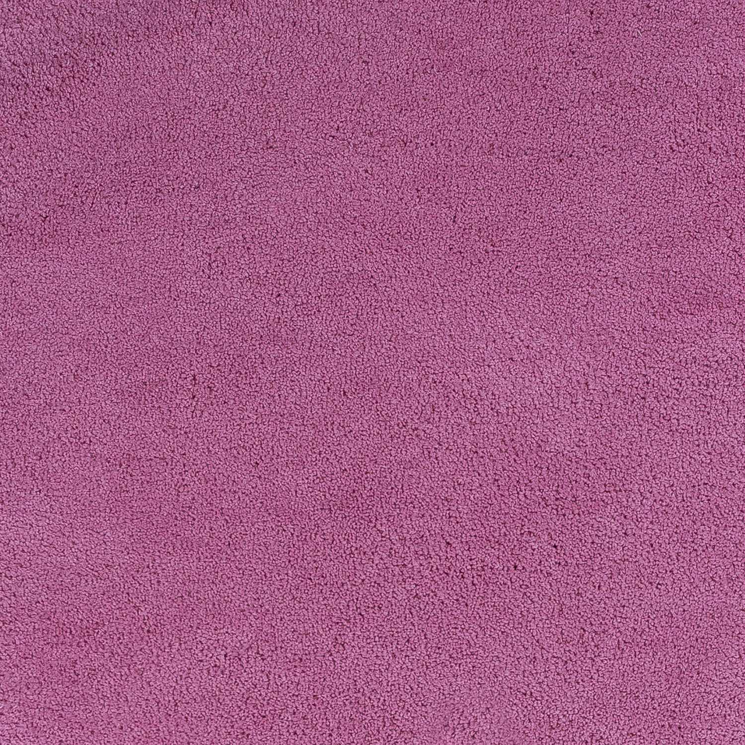 A vibrant hot pink indoor shag rug, hand woven with high-grade polyester and cotton backing, perfect for adding color and comfort to any room.