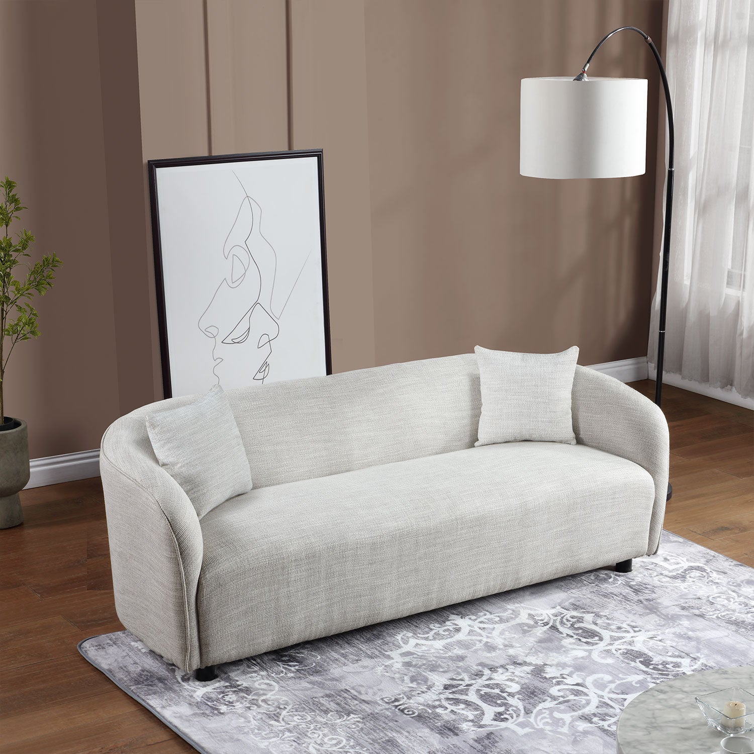 A stylish grey 3 seater bouclé sofa, showcasing its contemporary design and soft texture, perfect for living room decor.