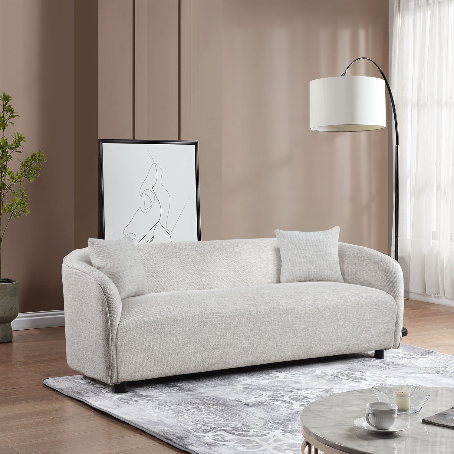 A stylish grey 3 seater bouclé sofa, showcasing its contemporary design and soft texture, perfect for living room decor.