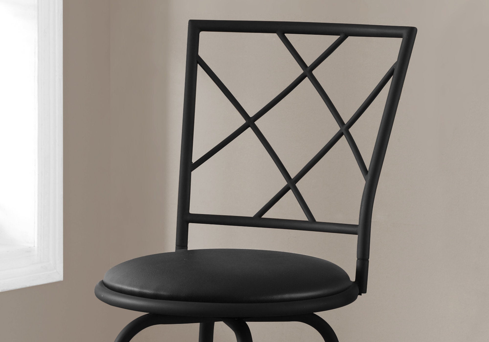 Set of 2 black metal foam leather-look barstools with criss-cross back design and footrest.