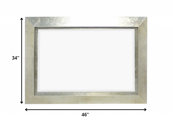 34 x 46 x 2.25 Silver Rectangular Cosmetic Mirror with a contemporary wooden frame and silver leaf finish, elegantly displayed on a wall.