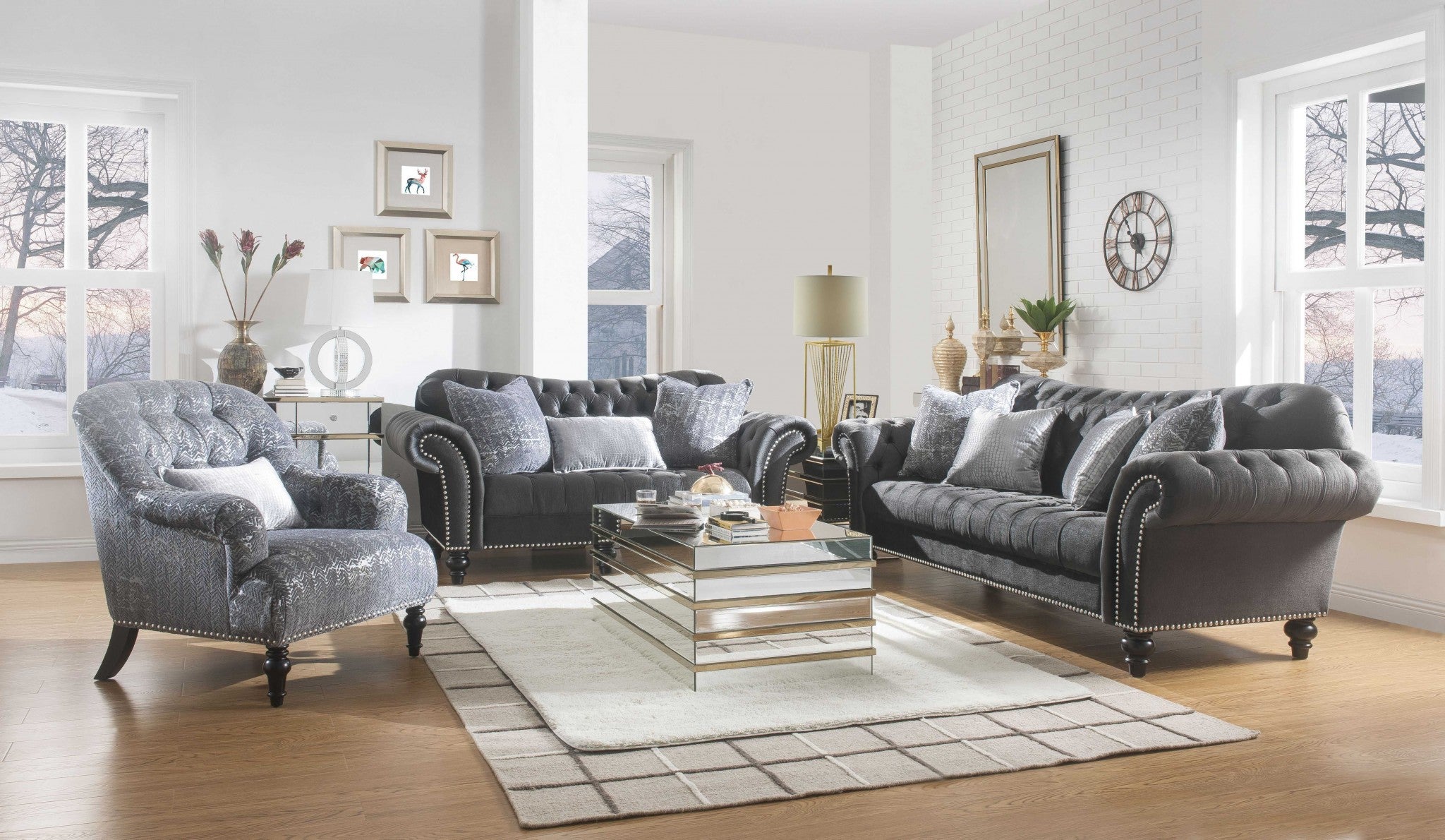 A stylish gray patterned velvet chair with a plush pillow, featuring button tufted back and arms, resting on black wood bun-turned legs.