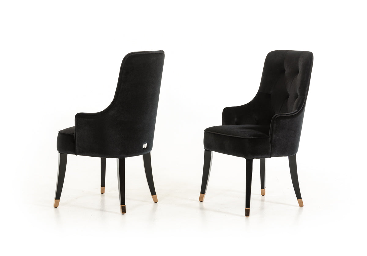 Elegant 38-inch black velvet fabric dining chair with sturdy wood legs, perfect for enhancing dining room decor.