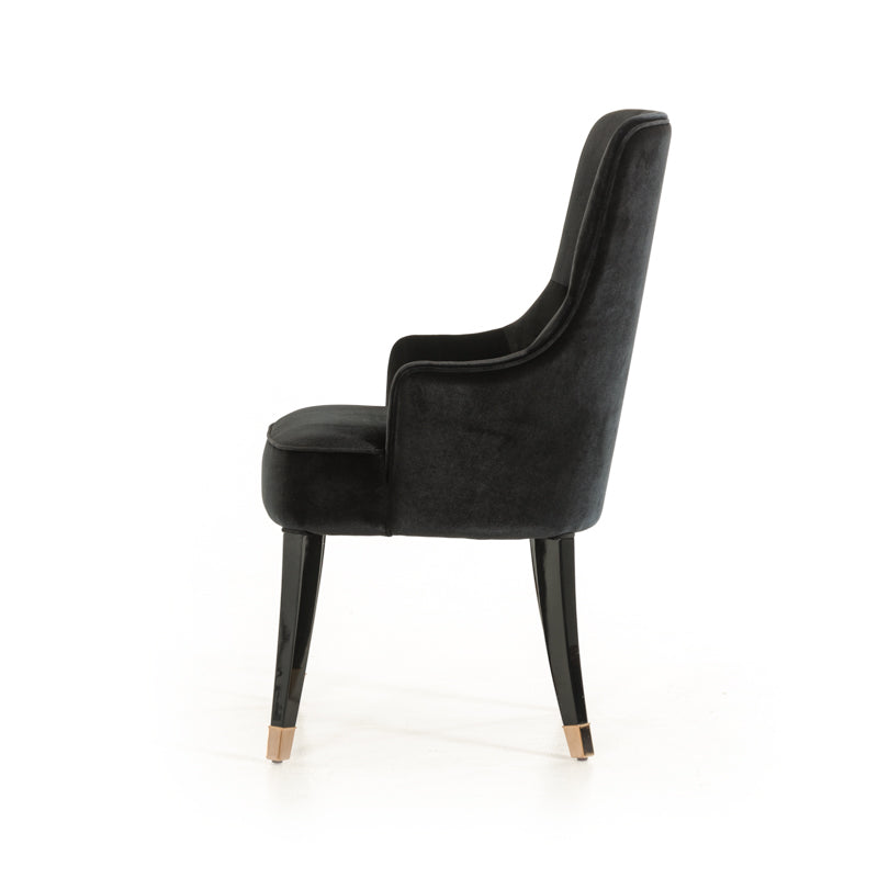 Elegant 38-inch black velvet fabric dining chair with sturdy wood legs, perfect for enhancing dining room decor.