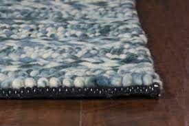 A handwoven 39 X 63 blue wool rug featuring a soft, nobby texture, perfect for contemporary living spaces.