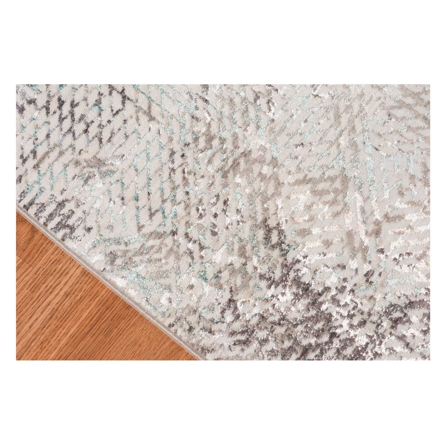 Gray polyester area rug with transitional design, measuring 3.93 x 5.57 inches, perfect for modern home decor.