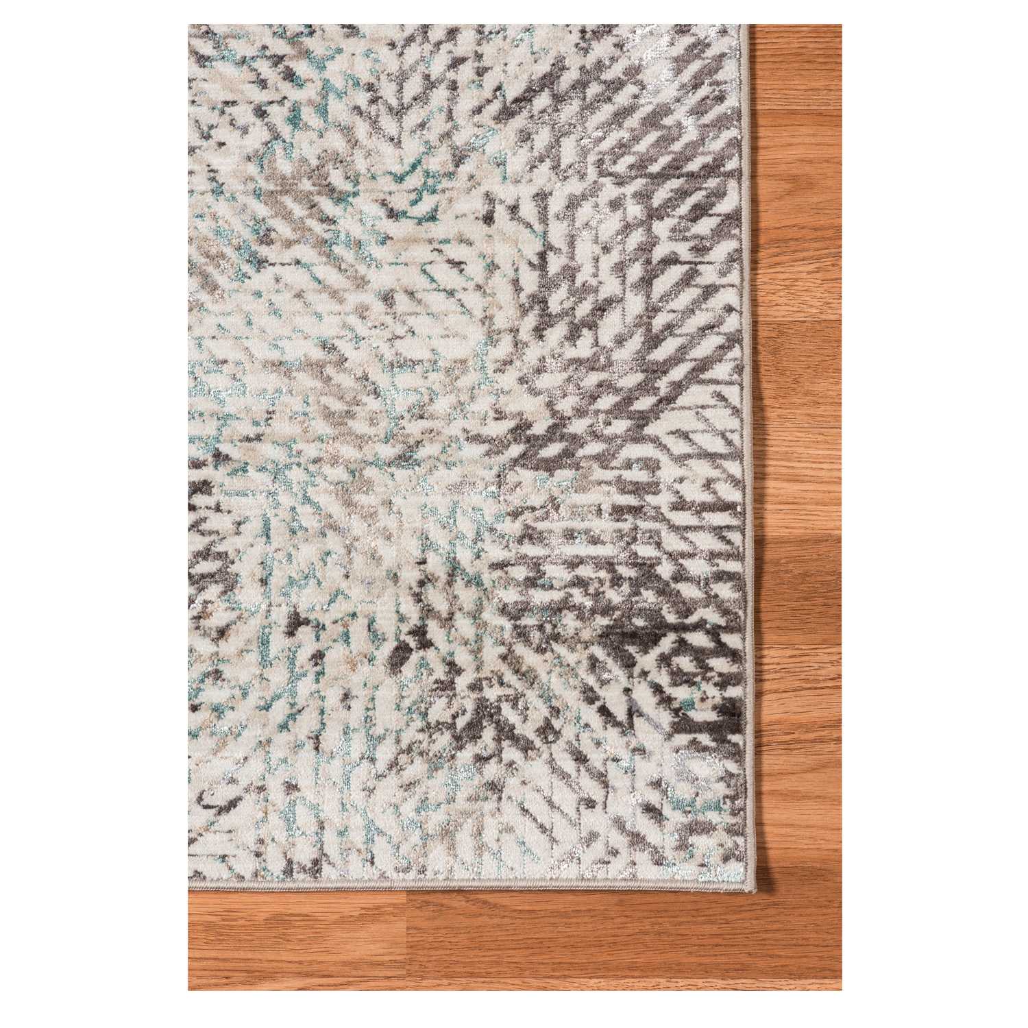 Gray polyester area rug with transitional design, measuring 3.93 x 5.57 inches, perfect for modern home decor.