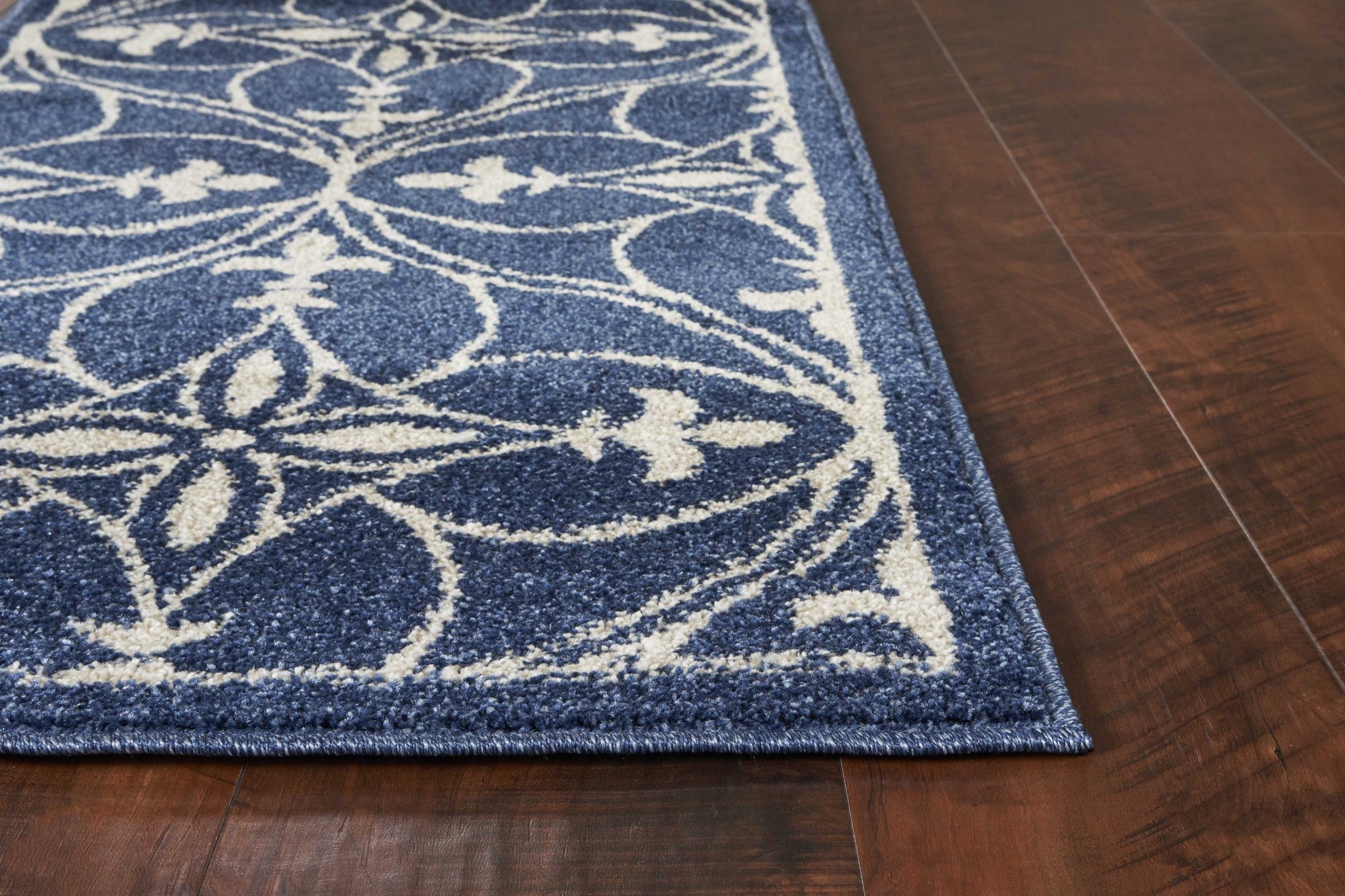 3x5 denim blue area rug made of UV treated polypropylene, showcasing elegant patterns and a soft texture.