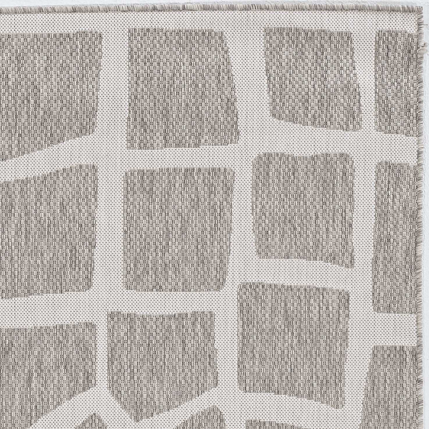 3x5 inches ivory and grey polypropylene area rug, showcasing its contemporary design and low pile height.