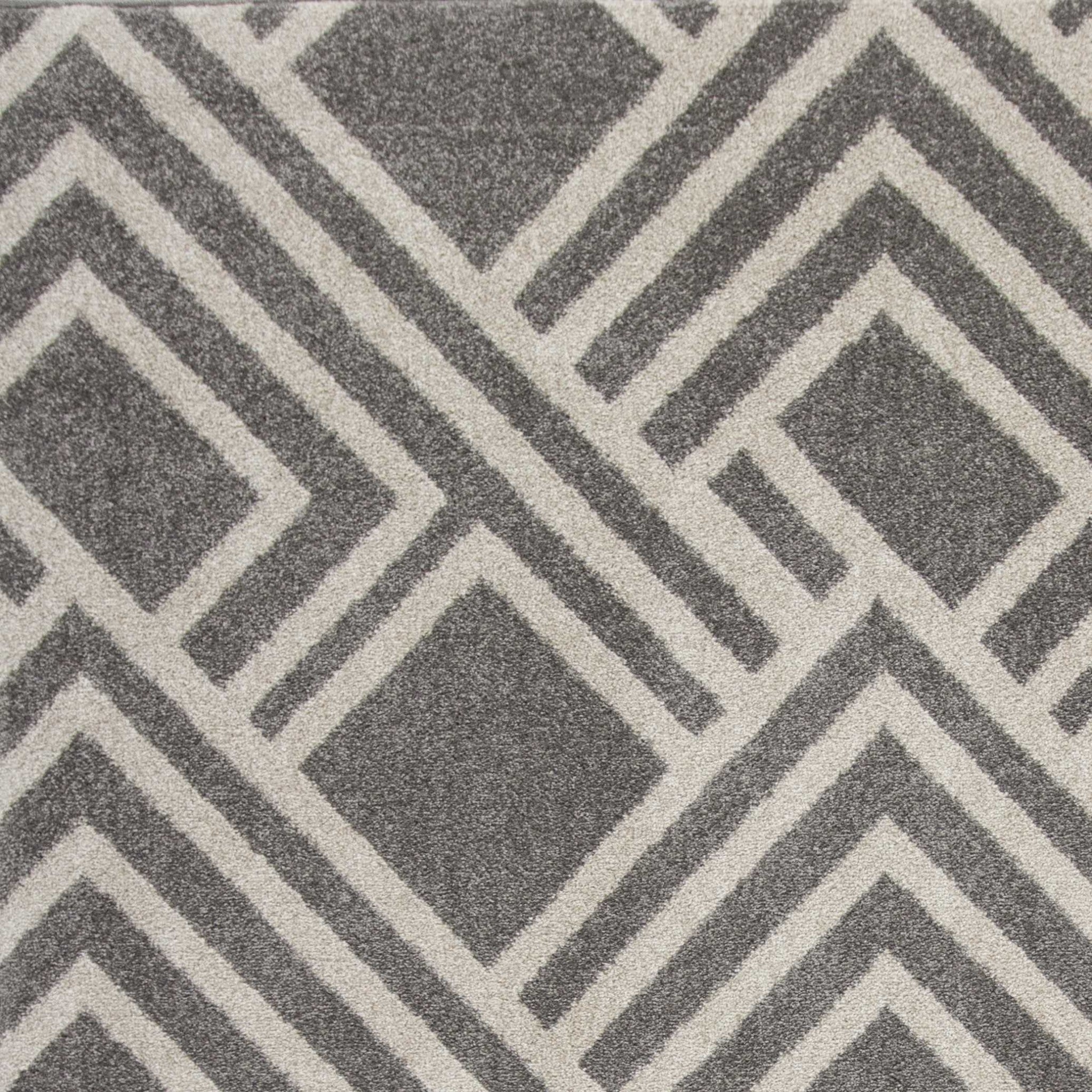 3x5 grey machine woven UV treated geometric rug suitable for indoor and outdoor use, showcasing a modern design.