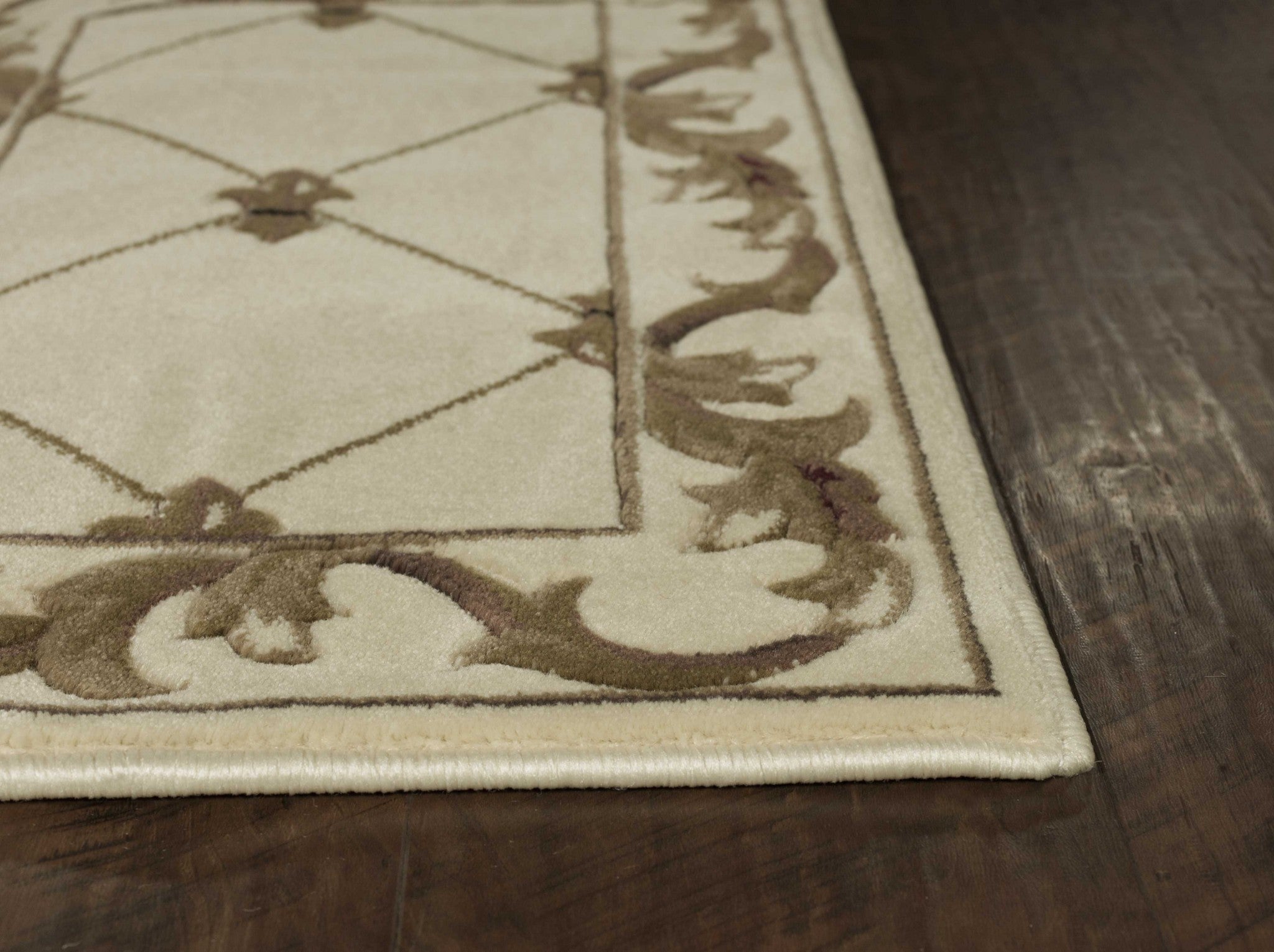 Ivory machine woven hand carved fleur-de-lis indoor rug, showcasing intricate details and elegant design.