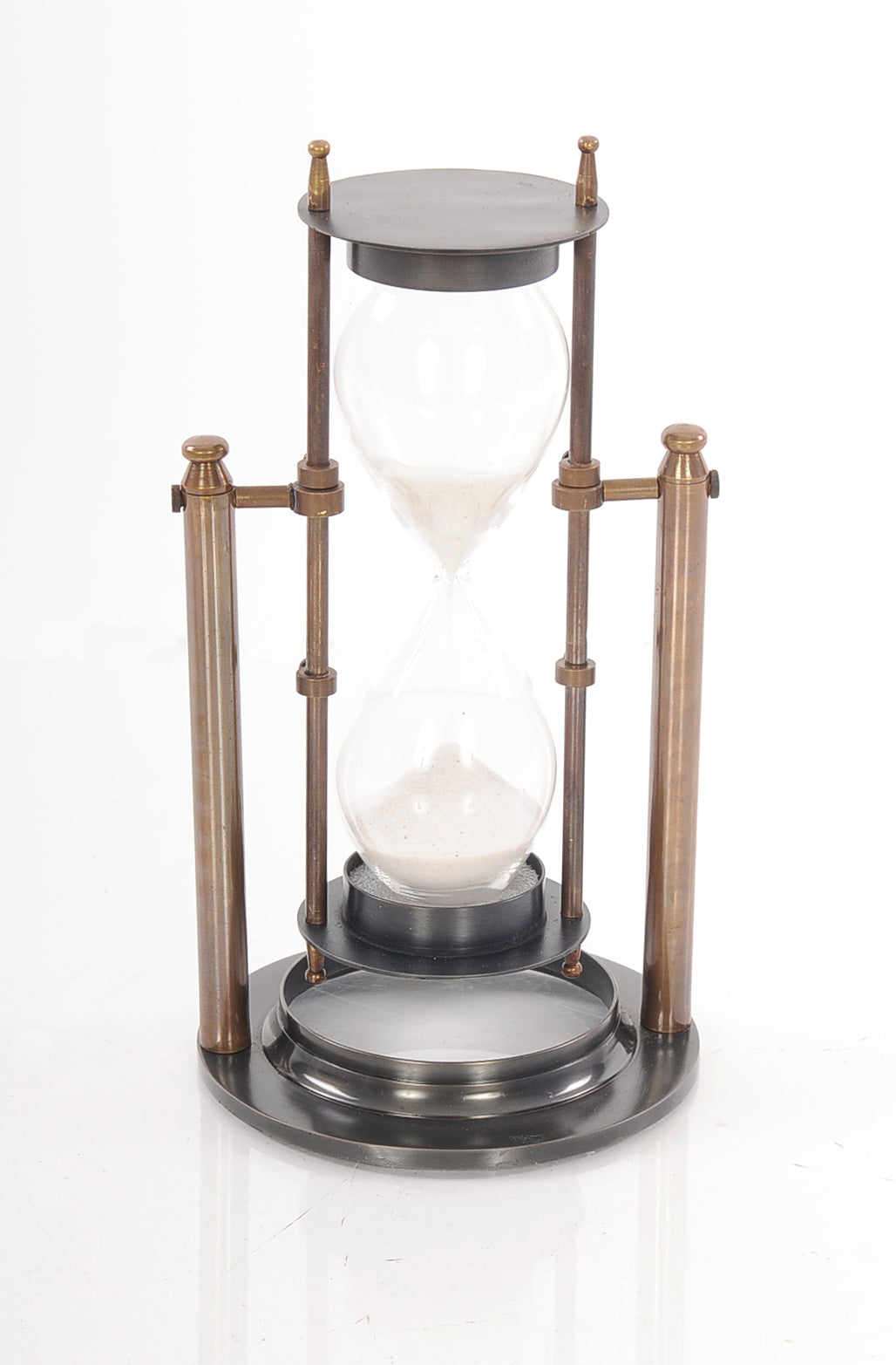 A beautifully crafted brass revolving sandtimer with an antique finish, measuring 4.5x4.5x8.5 inches, showcasing flowing sand.