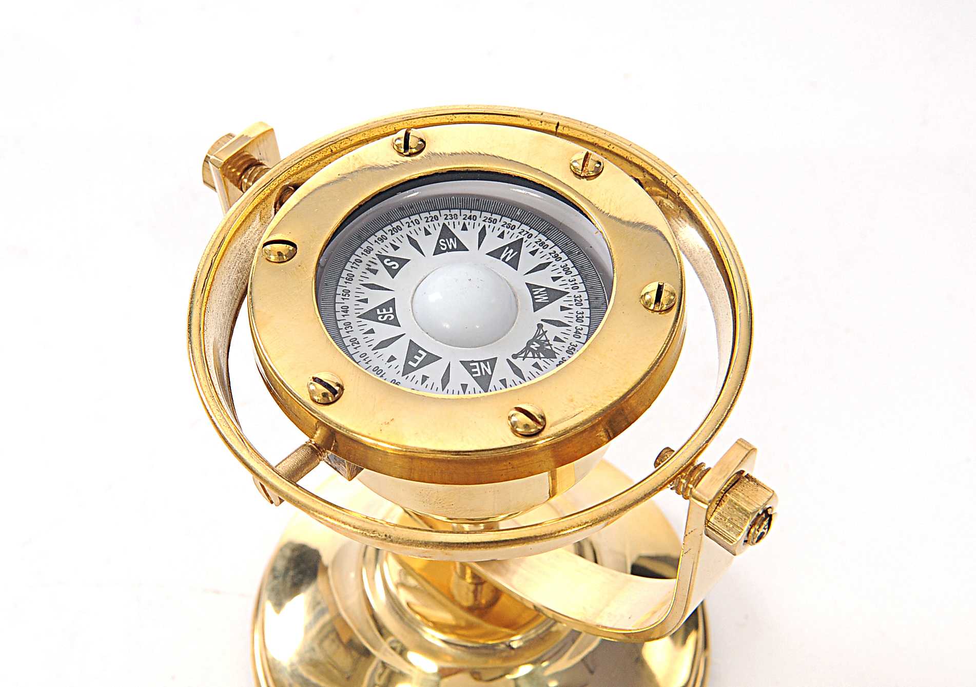 A beautifully crafted gimbaled compass made of high-quality brass with a shiny finish, measuring 4.5 inches wide, 5 inches long, and 5.5 inches high.