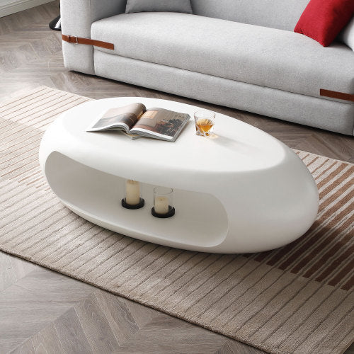 A sleek 47.24'' modern oval coffee table made of sturdy fiberglass, featuring a minimalist white design, perfect for living room decor.