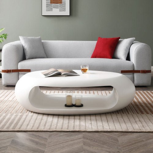 A sleek 47.24'' modern oval coffee table made of sturdy fiberglass, featuring a minimalist white design, perfect for living room decor.