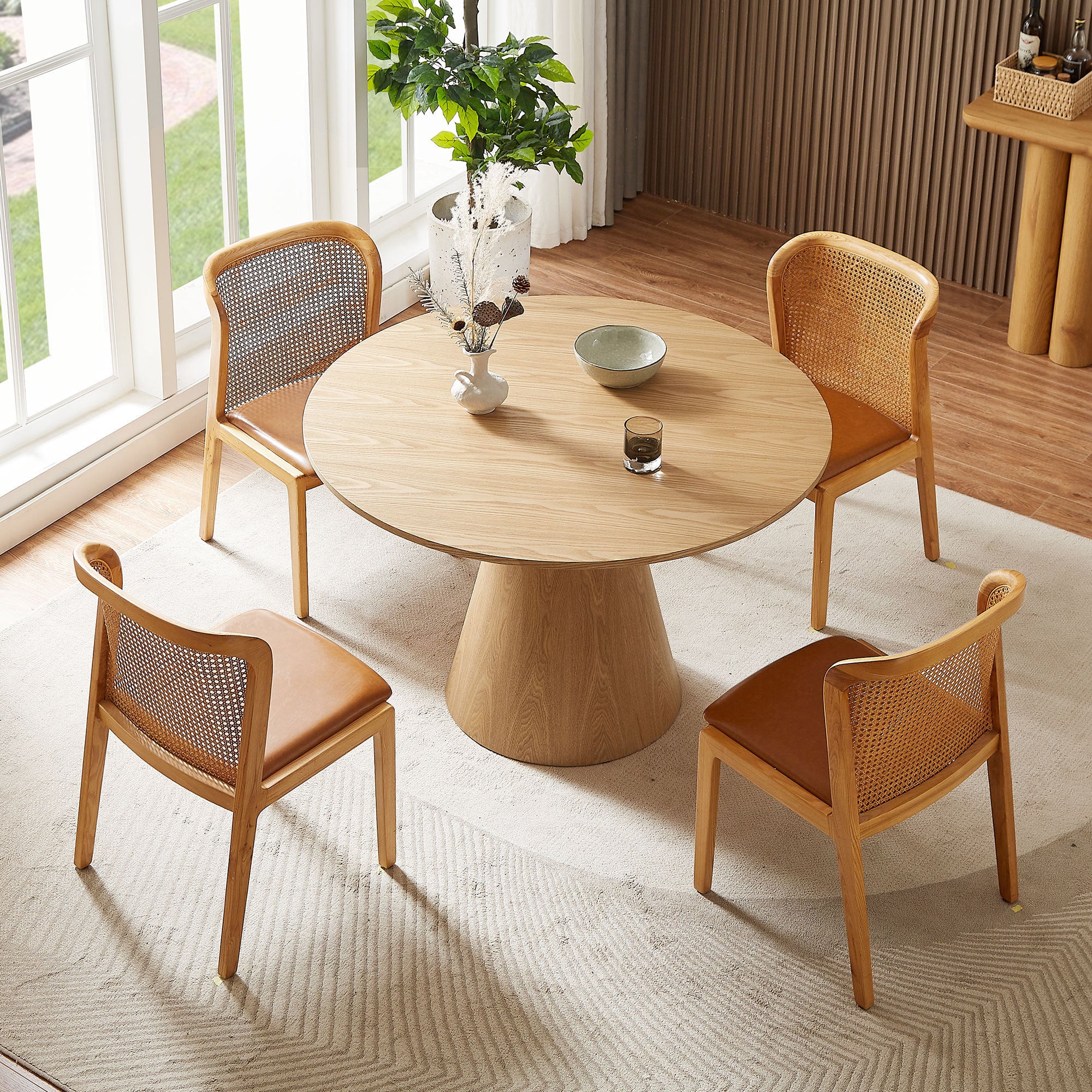 A stylish 47.24'' round wooden dining table made from hardwood solids, featuring a natural ash finish, perfect for dining rooms or kitchens.