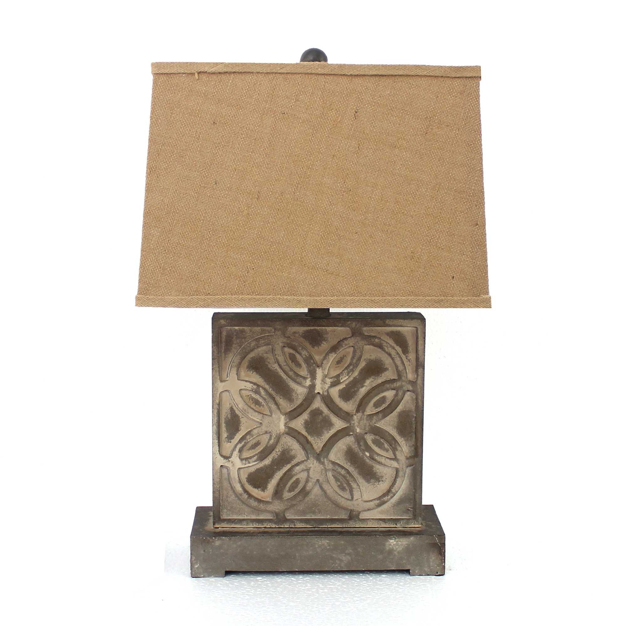 A vintage table lamp featuring a brown hammered metal base and a khaki linen shade, perfect for home decor.