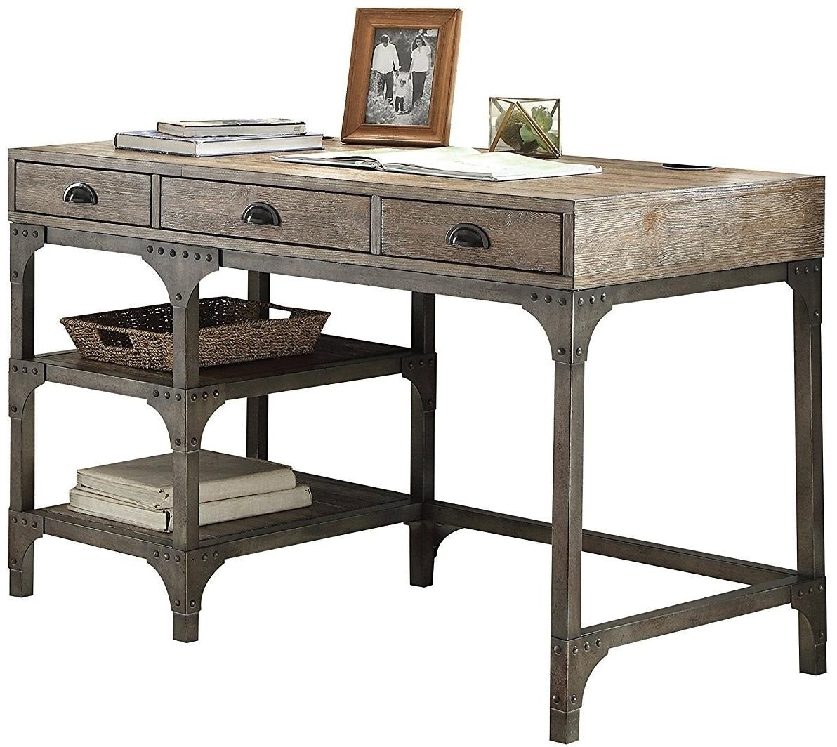 A stylish 47x24x29 weathered oak desk with antique silver legs, featuring three drawers and two shelves for storage.