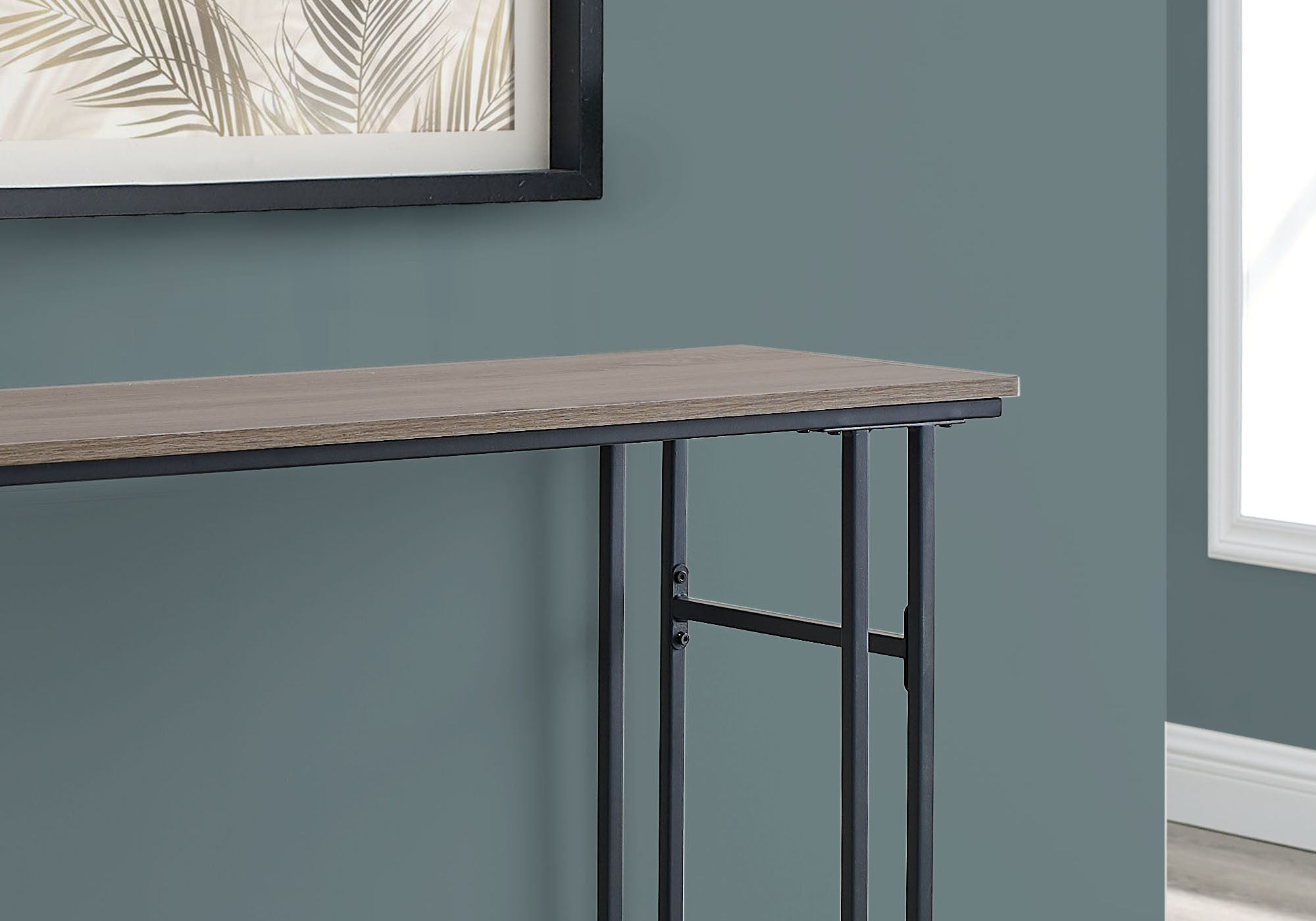 A stylish 48-inch rectangular grey and black metal hall console accent table, featuring a sleek reclaimed taupe finish and sturdy H frame.