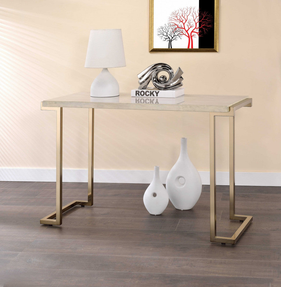 A stylish faux marble and champagne sofa table featuring a clean marble top and geometric champagne metal base, perfect for modern living rooms.