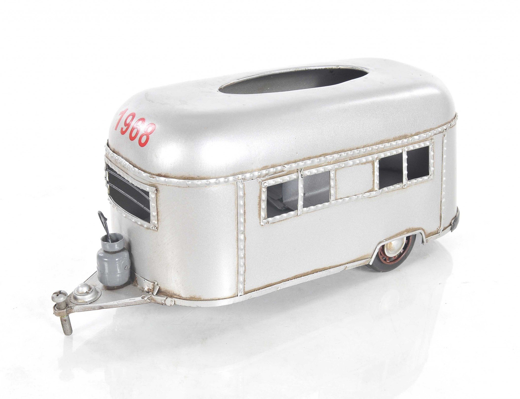 A charming 5x12x4.5 inches camping trailer tissue holder made of metal, featuring movable wheels and a hidden door for easy tissue access.