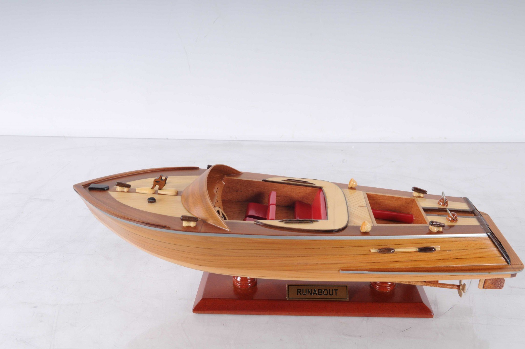 5 inches x 16 inches x 5 inches handcrafted Runabout Canoe model made from mahogany and exotic woods, featuring intricate details and a wooden stand.