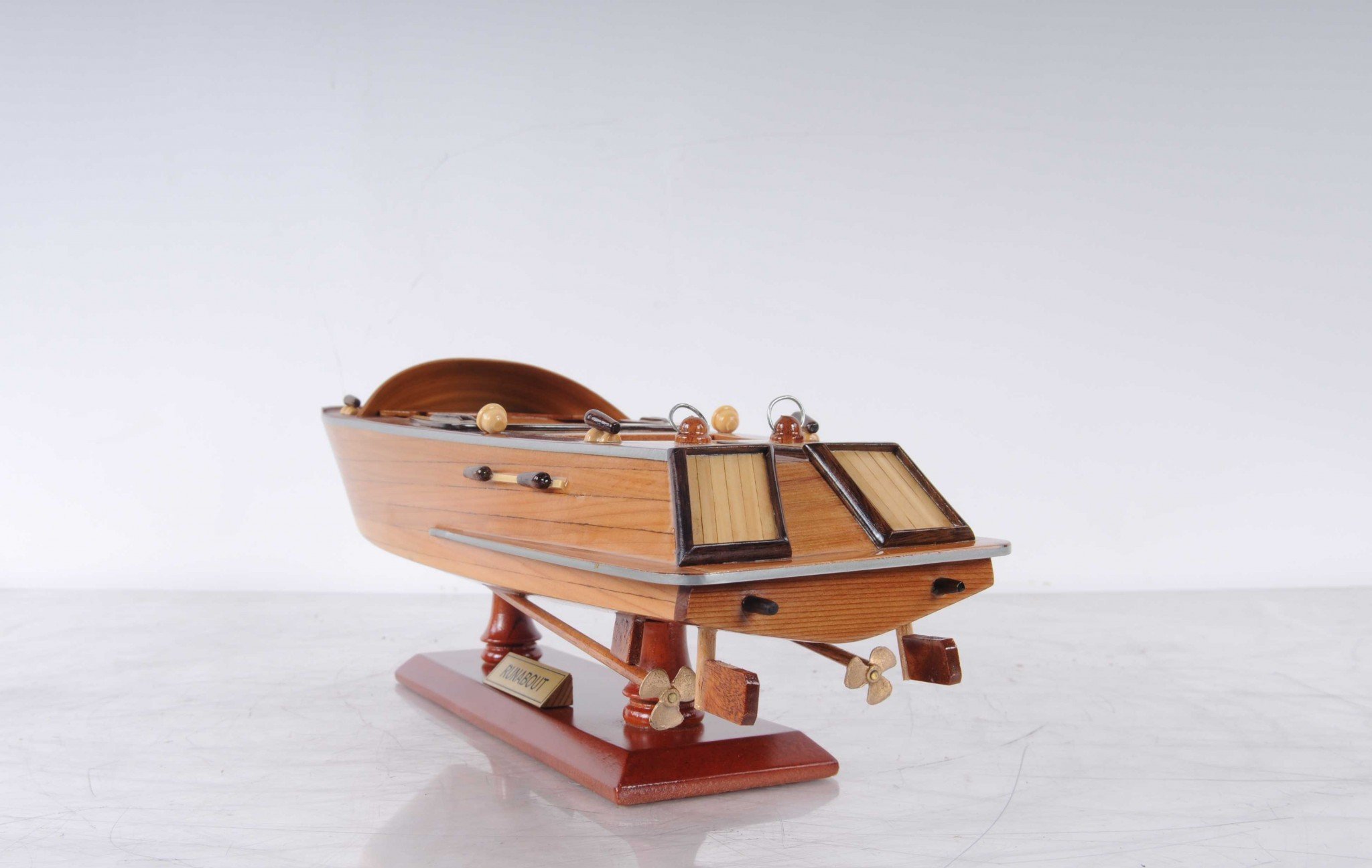 5 inches x 16 inches x 5 inches handcrafted Runabout Canoe model made from mahogany and exotic woods, featuring intricate details and a wooden stand.