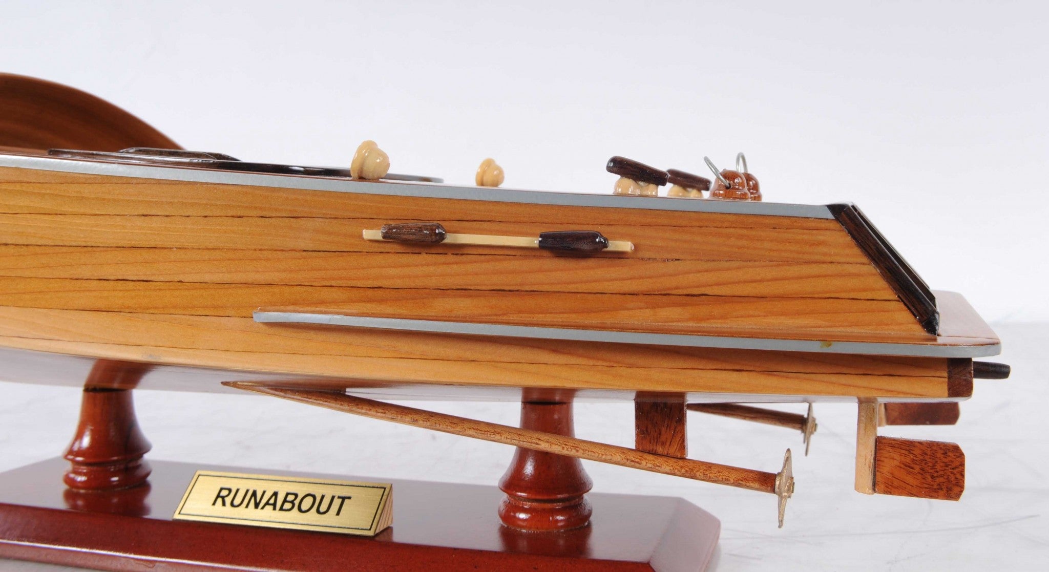 5 inches x 16 inches x 5 inches handcrafted Runabout Canoe model made from mahogany and exotic woods, featuring intricate details and a wooden stand.