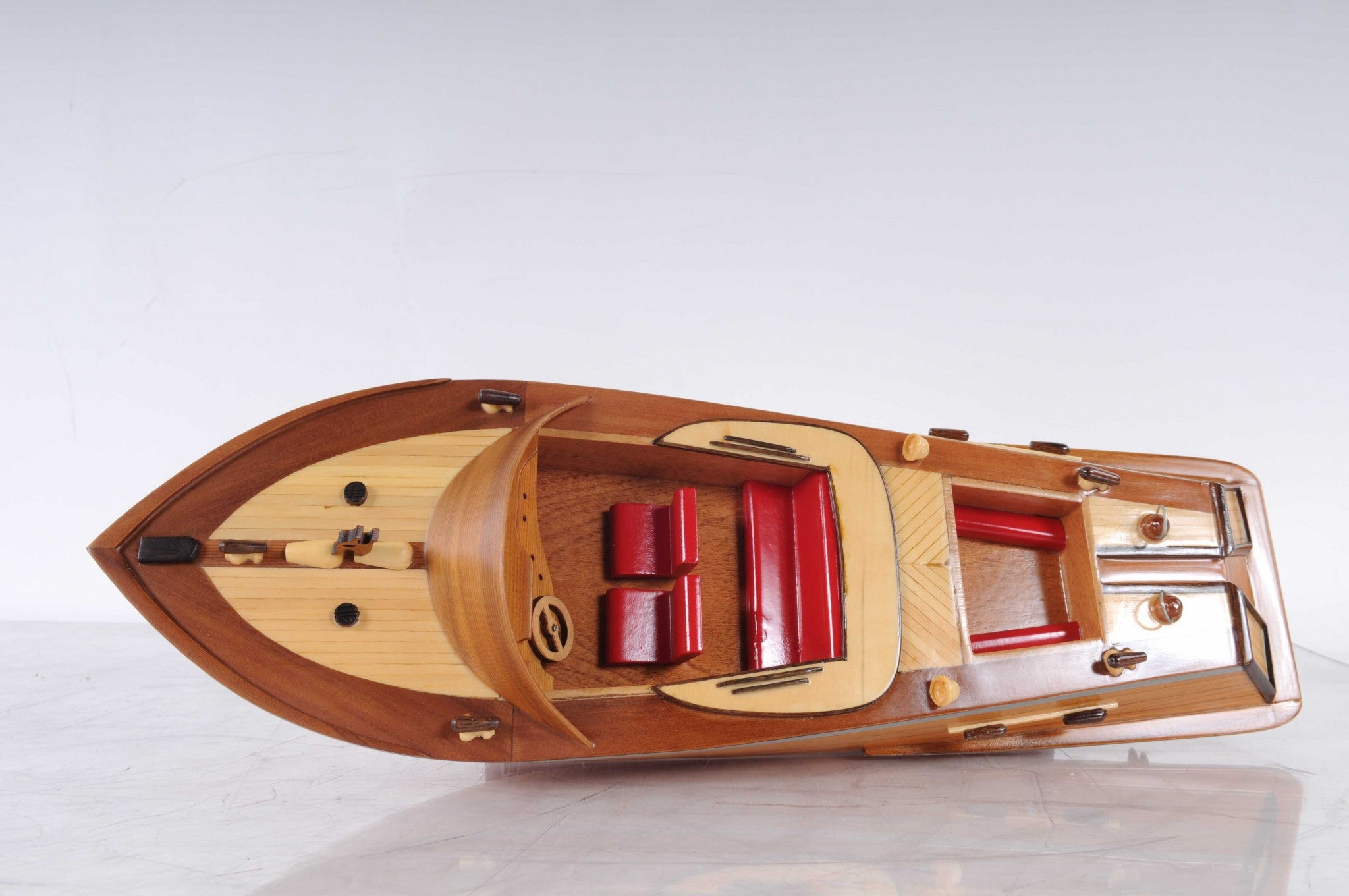 5 inches x 16 inches x 5 inches handcrafted Runabout Canoe model made from mahogany and exotic woods, featuring intricate details and a wooden stand.