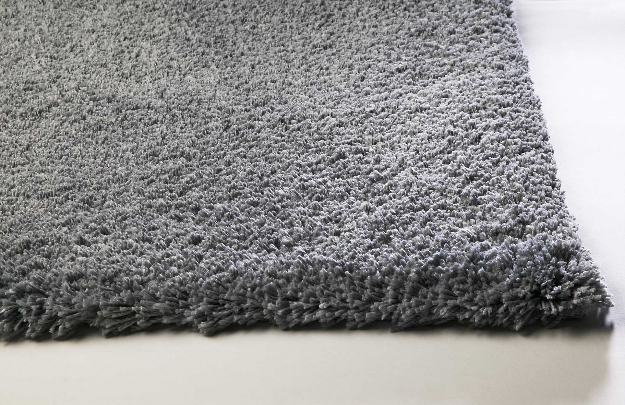 5x7 grey plain indoor area rug with soft texture and modern design, perfect for enhancing home decor.