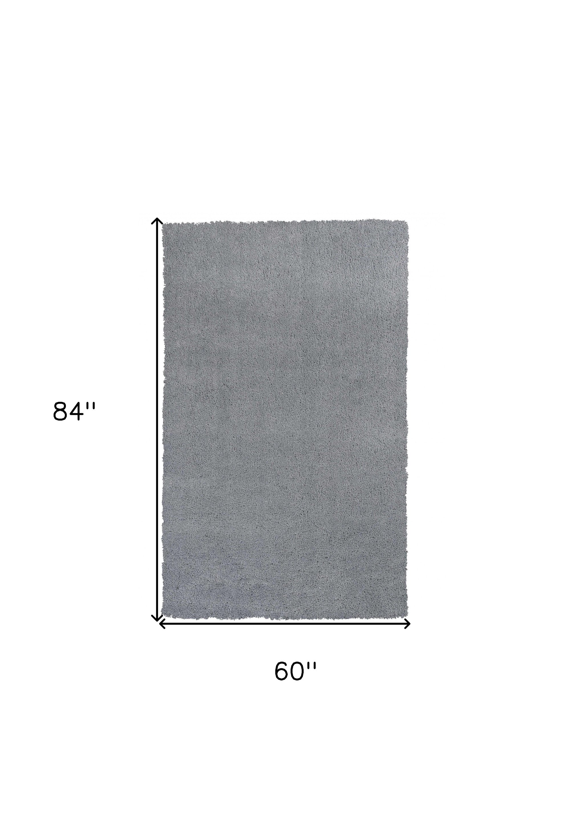 5x7 grey plain indoor area rug with soft texture and modern design, perfect for enhancing home decor.