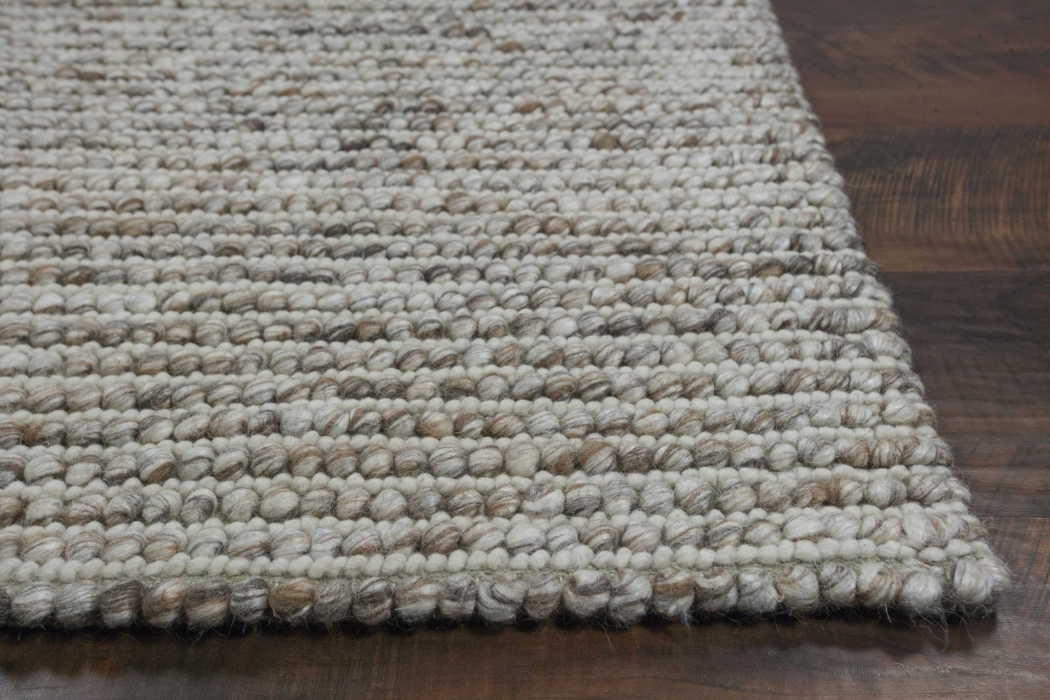 5x7 natural wool boucle Berber style area rug with a soft, nobby texture in neutral tones, perfect for living room decor.